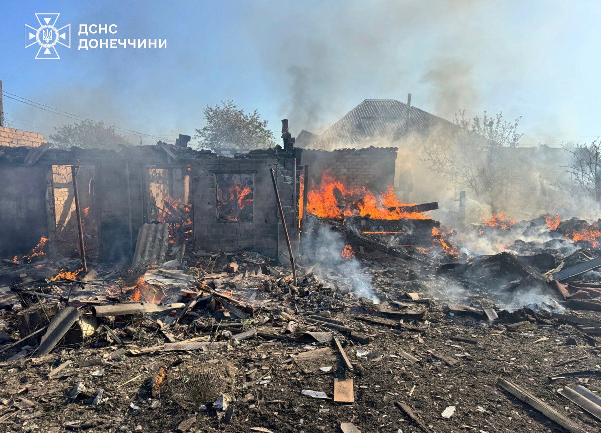 In this photo provided by the Ukrainian Emergency Service, damaged private houses burn following Russia's air raid in the Donetsk region, Ukraine, Monday, April 28, 2025. (Ukrainian Emergency Service via AP)