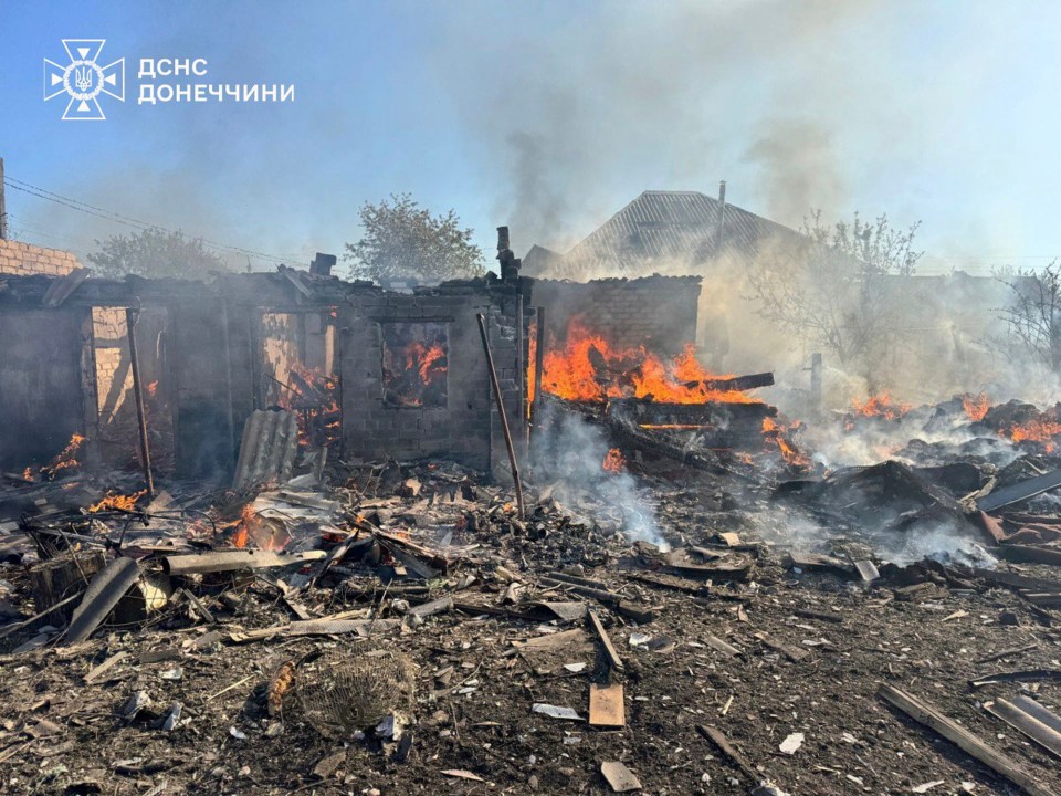 In this photo provided by the Ukrainian Emergency Service, damaged private houses burn following Russia's air raid in the Donetsk region, Ukraine, Monday, April 28, 2025. (Ukrainian Emergency Service via AP)