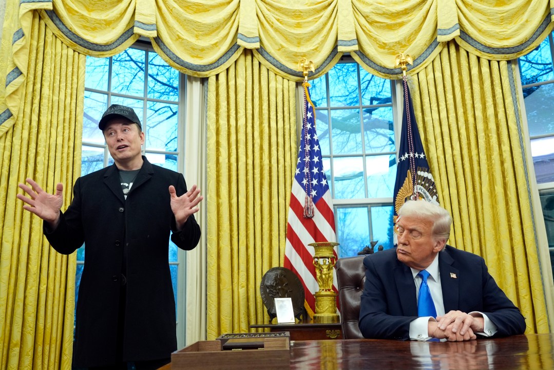 President Donald Trump listens as Elon Musk speaks in the Oval Office at the White House, Tuesday, Feb. 11, 2025, in Washington. (AP Photo/Alex Brandon)