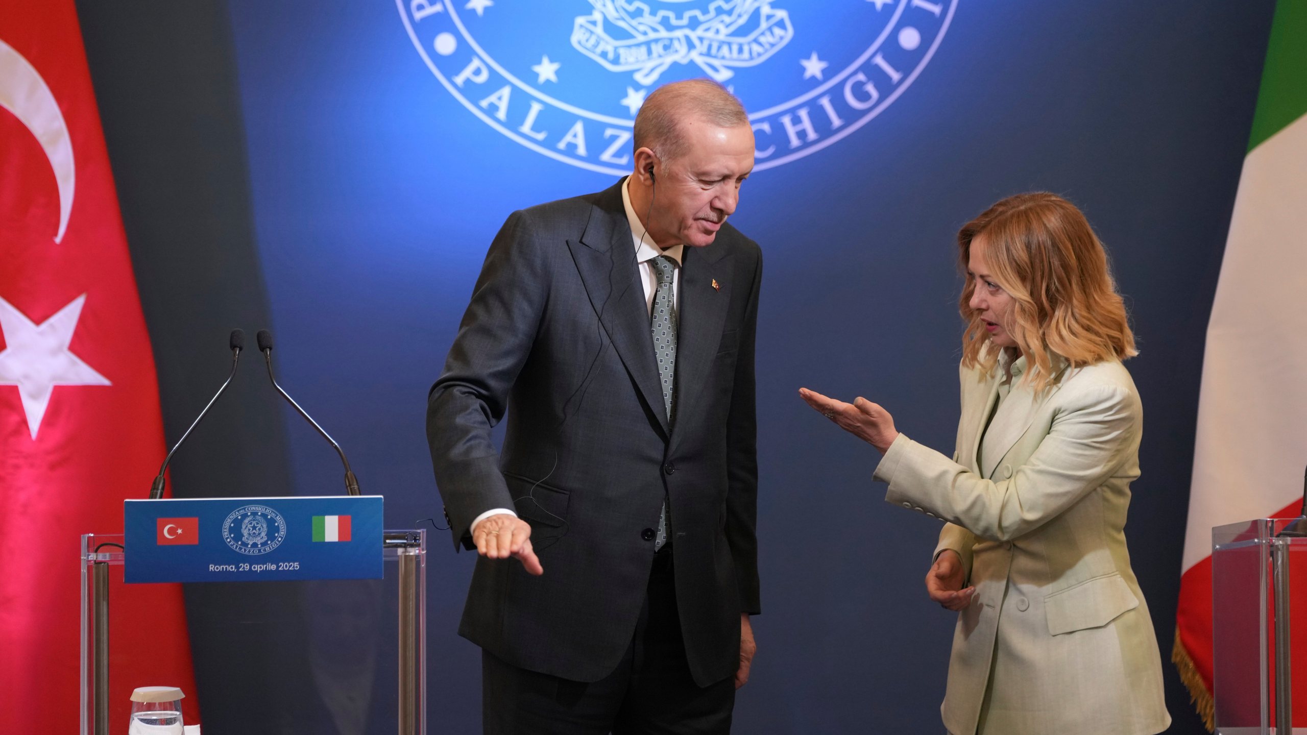Turkish President Recep Tayyip Erdogan, left, and Italian Premier Giorgia Meloni arrive for a joint press conference after their meeting, at Villa Pamphilj in Rome, Tuesday, April 29, 2025. (AP Photo/Francisco Seco)