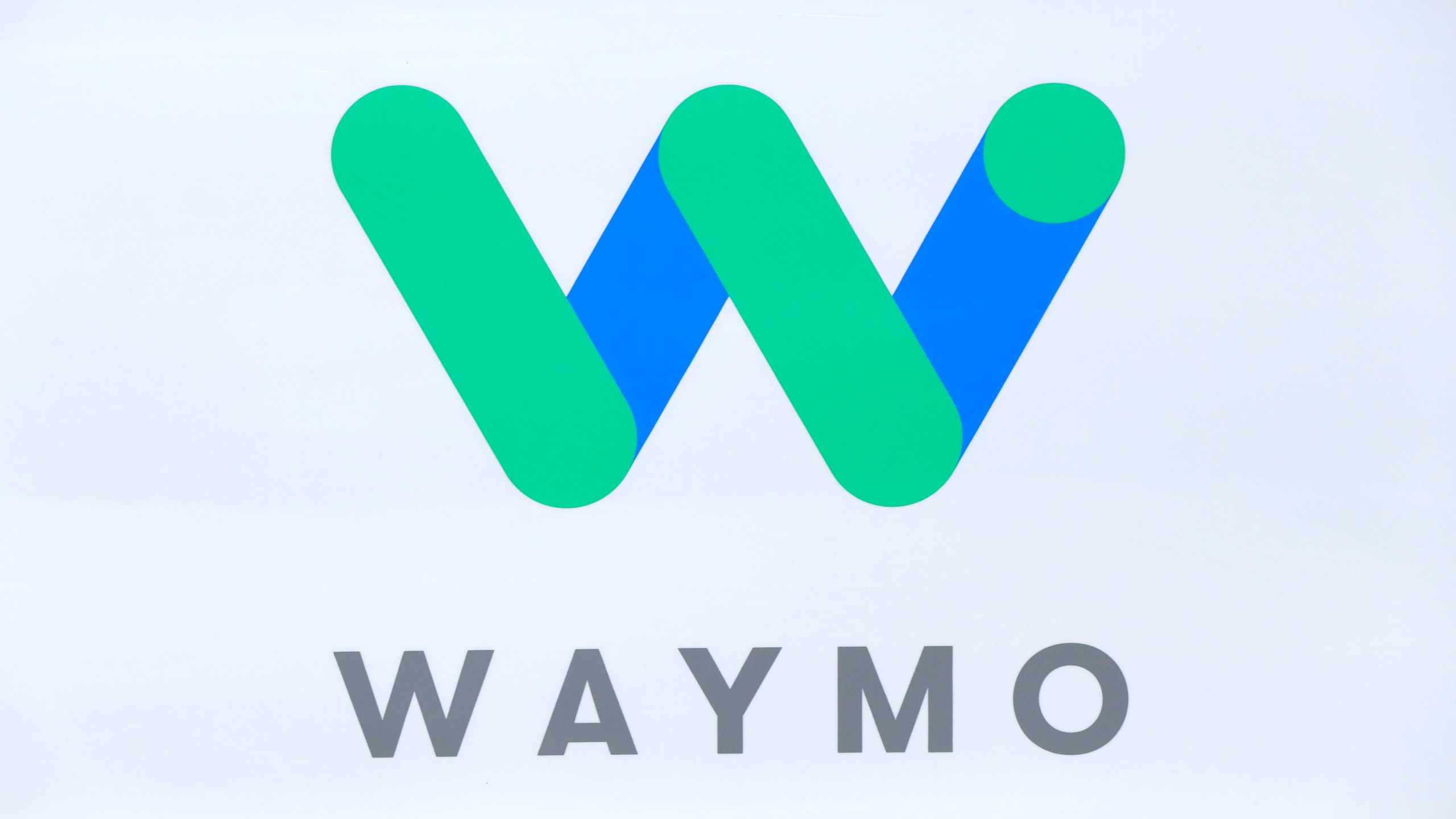 FILE - The Waymo logo is shown at the North American International Auto Show in Detroit, Sunday, Jan. 8, 2017. (AP Photo/Paul Sancya, File)