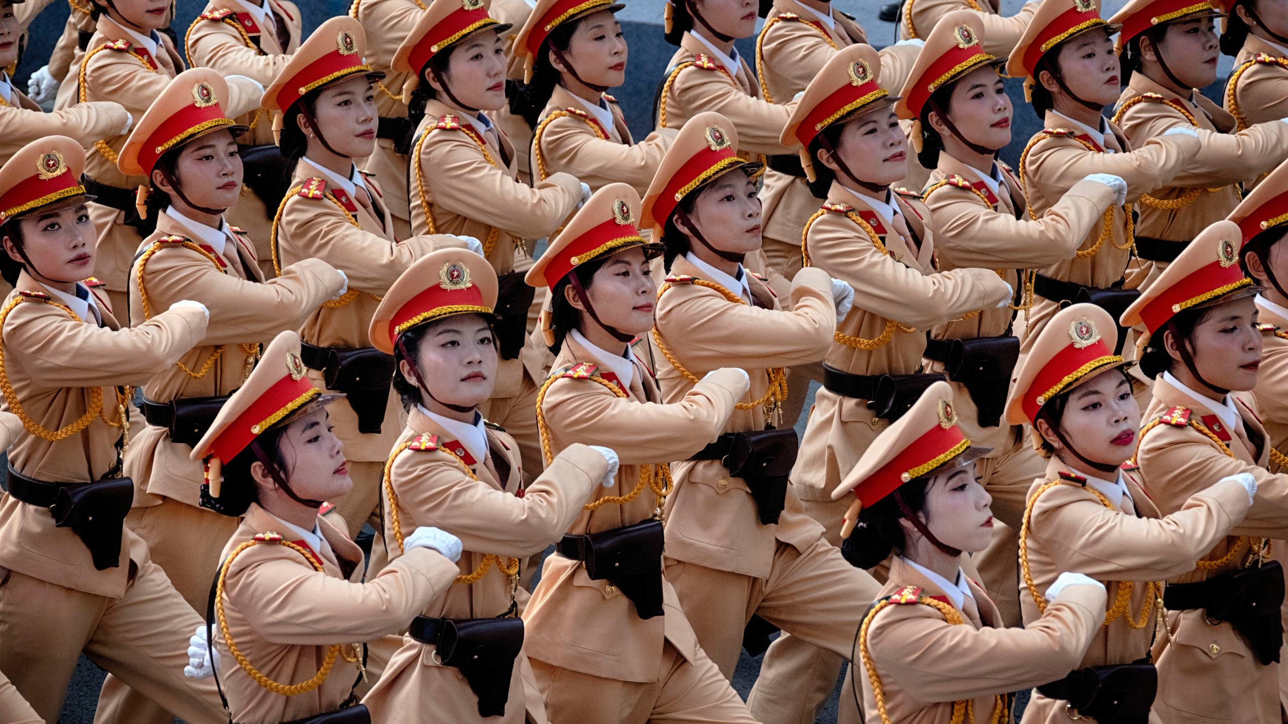 Vietnamese female police officers march during a parade celebrating the 50th anniversary of the end of the Vietnam War on Wednesday, April 30, 2025, in Ho Chi Minh City, Vietnam. (AP Photo/Richard Vogel)