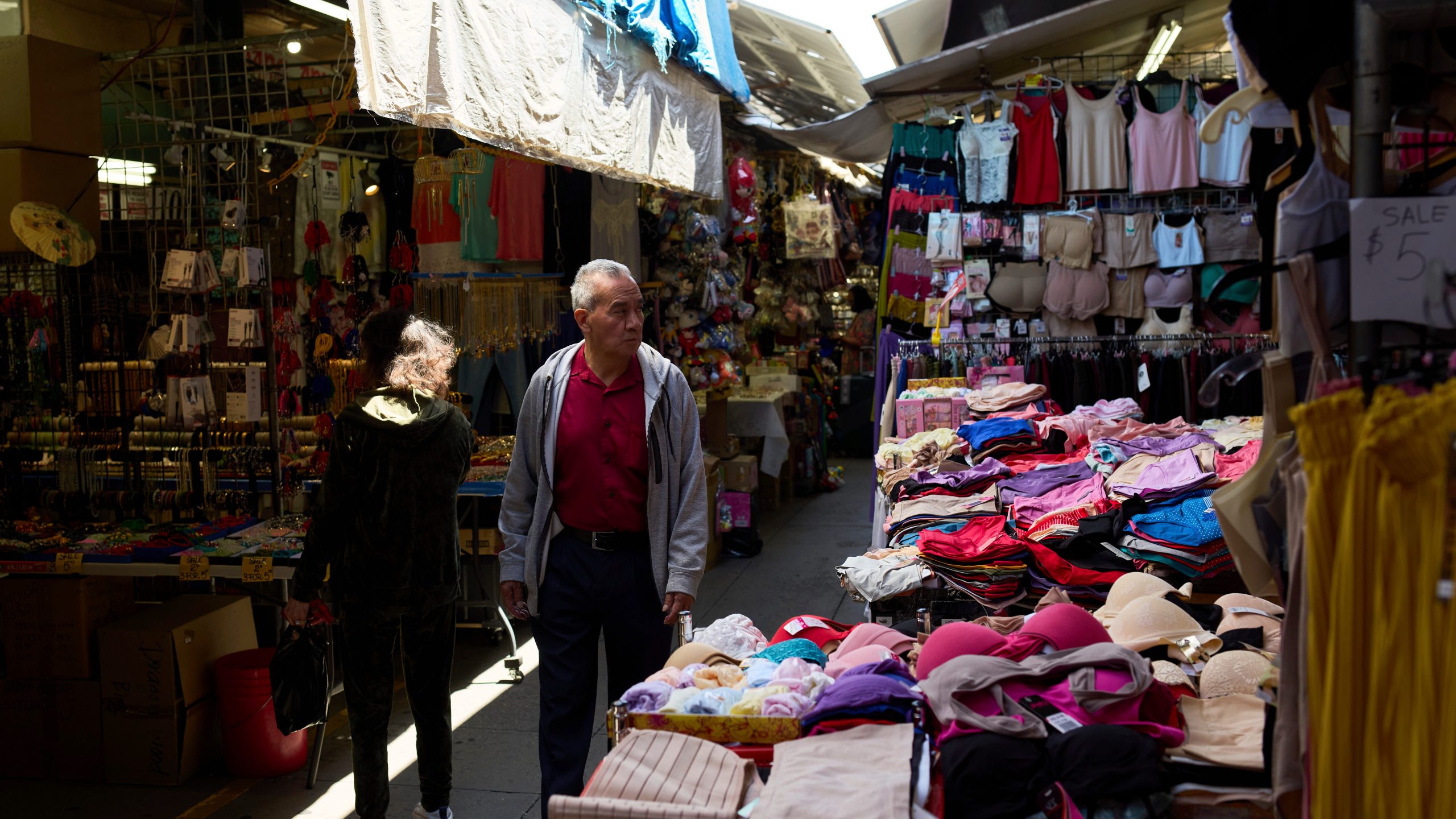 Shoppers move through a market in the Chinatown neighborhood of Los Angeles, Monday, April 21, 2025. (AP Photo/Andy Bao)