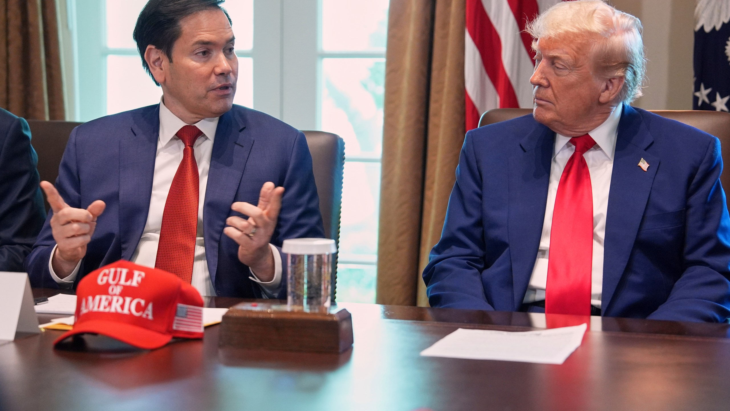 Secretary of State Marco Rubio speaks during a cabinet meeting at the White House, Wednesday, April 30, 2025, in Washington, as President Donald Trump look on. (AP Photo/Evan Vucci)