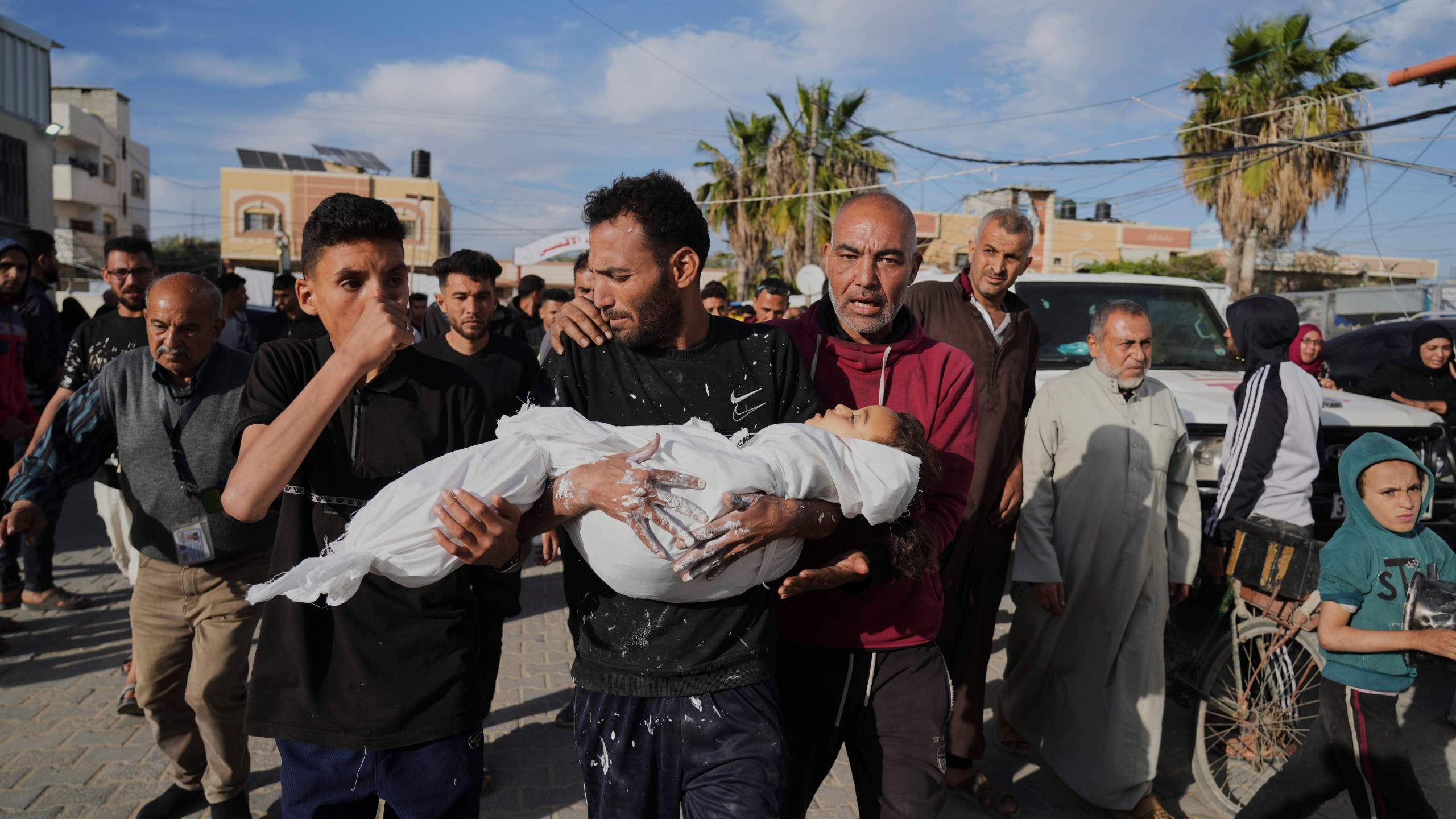 CORRECTS NAME TO MASSA, NOT MASHA - Relatives of Palestinian child, Massa Abed, 4, who was killed in an Israeli army airstrike on the Gaza Strip, carry her body at Al-Aqsa Hospital in Deir al-Balah, Gaza, Sunday, April 27, 2025. (AP Photo/Abdel Kareem Hana)
