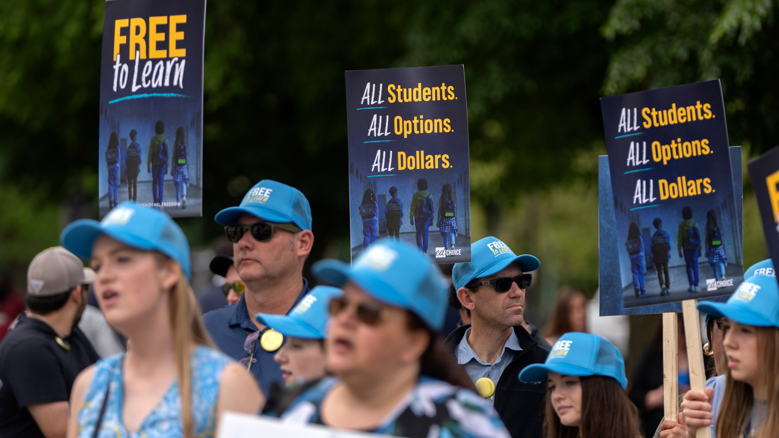Supporters of charter schools rally outside of the Supreme Court on Wednesday, April 30, 2025, in Washington. (AP Photo/Mark Schiefelbein)