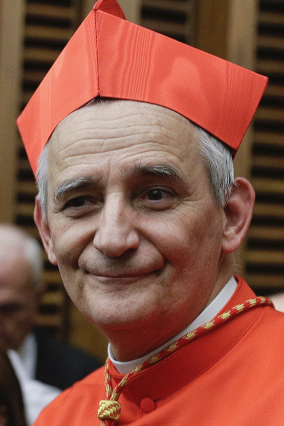 Cardinal Matteo Zuppi poses for photographers at the Vatican