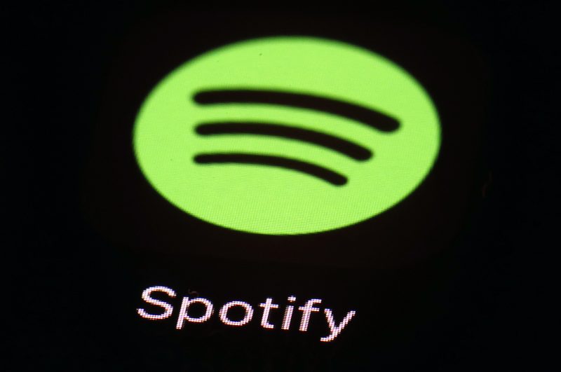 The green Spotify logo on a black background
