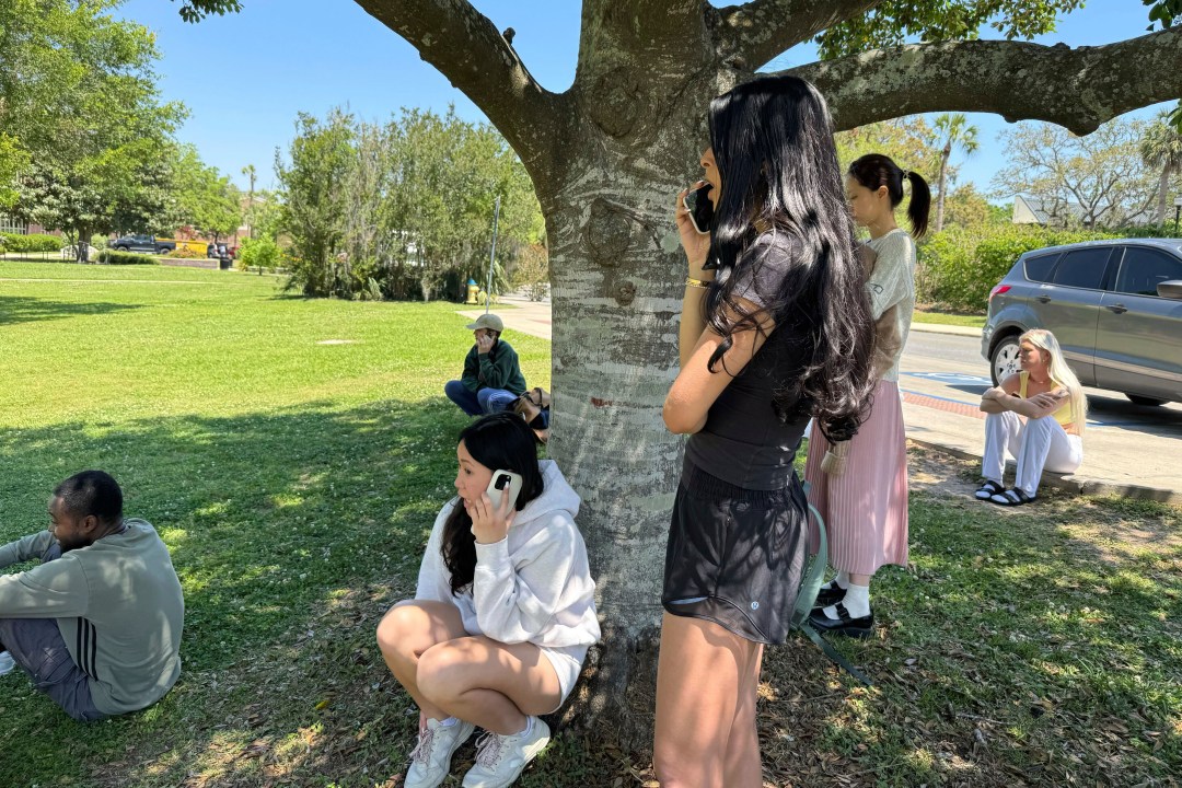 Florida State University students wait for news amid an active shooter incident