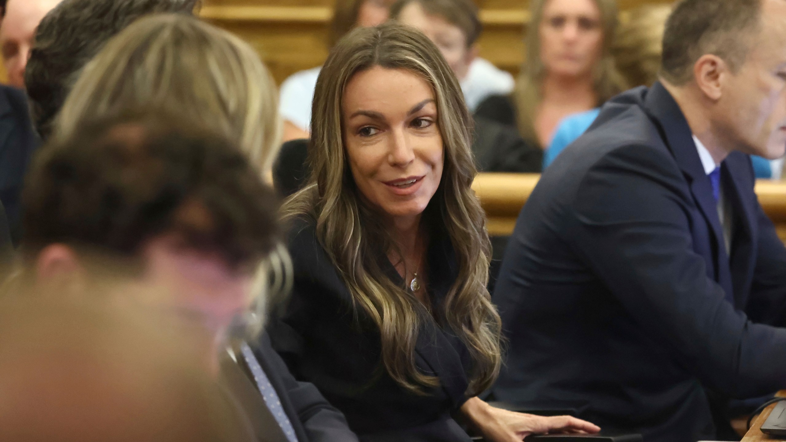 Karen Read listens in a courtroom