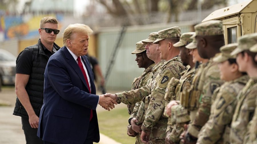 Trump shakes hands with servicemembers