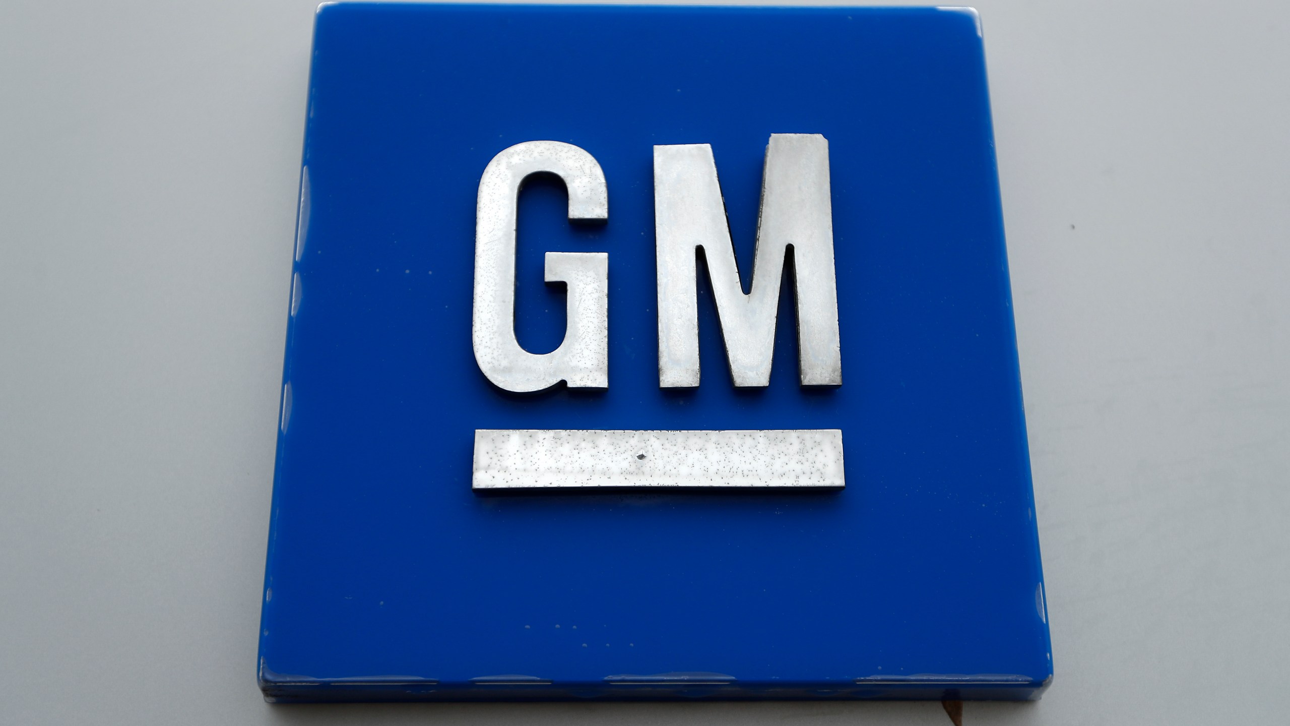 FILE - The General Motors logo is displayed at the General Motors Detroit-Hamtramck Assembly plant in Hamtramck, Mich., Jan. 27, 2020. (AP Photo/Paul Sancya, File)