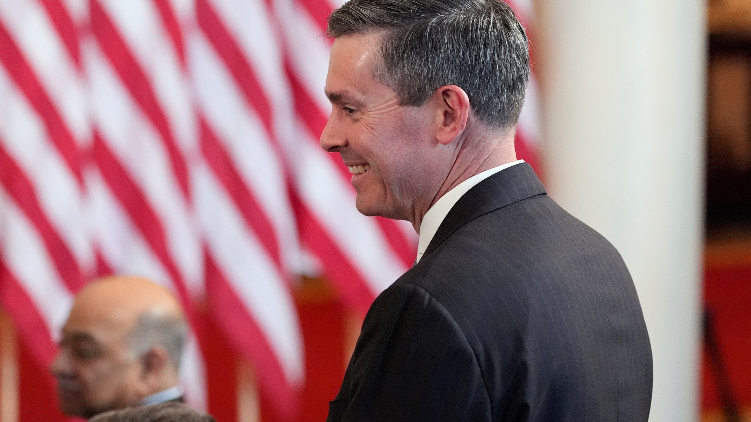 Eli Lilly and Company CEO David Ricks stands as President Donald Trump speaks about investing in America in the Cross Hall of the White House, Wednesday, April 30, 2025, in Washington. (AP Photo/Alex Brandon)