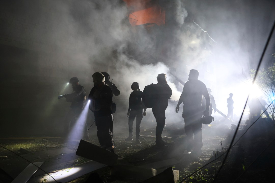 Emergency personnel work at the site of a residential building destroyed by a Russian strike in Zaporizhzhia, Ukraine, on Thursday, May 1, 2025. (AP Photo/Kateryna Klochko)