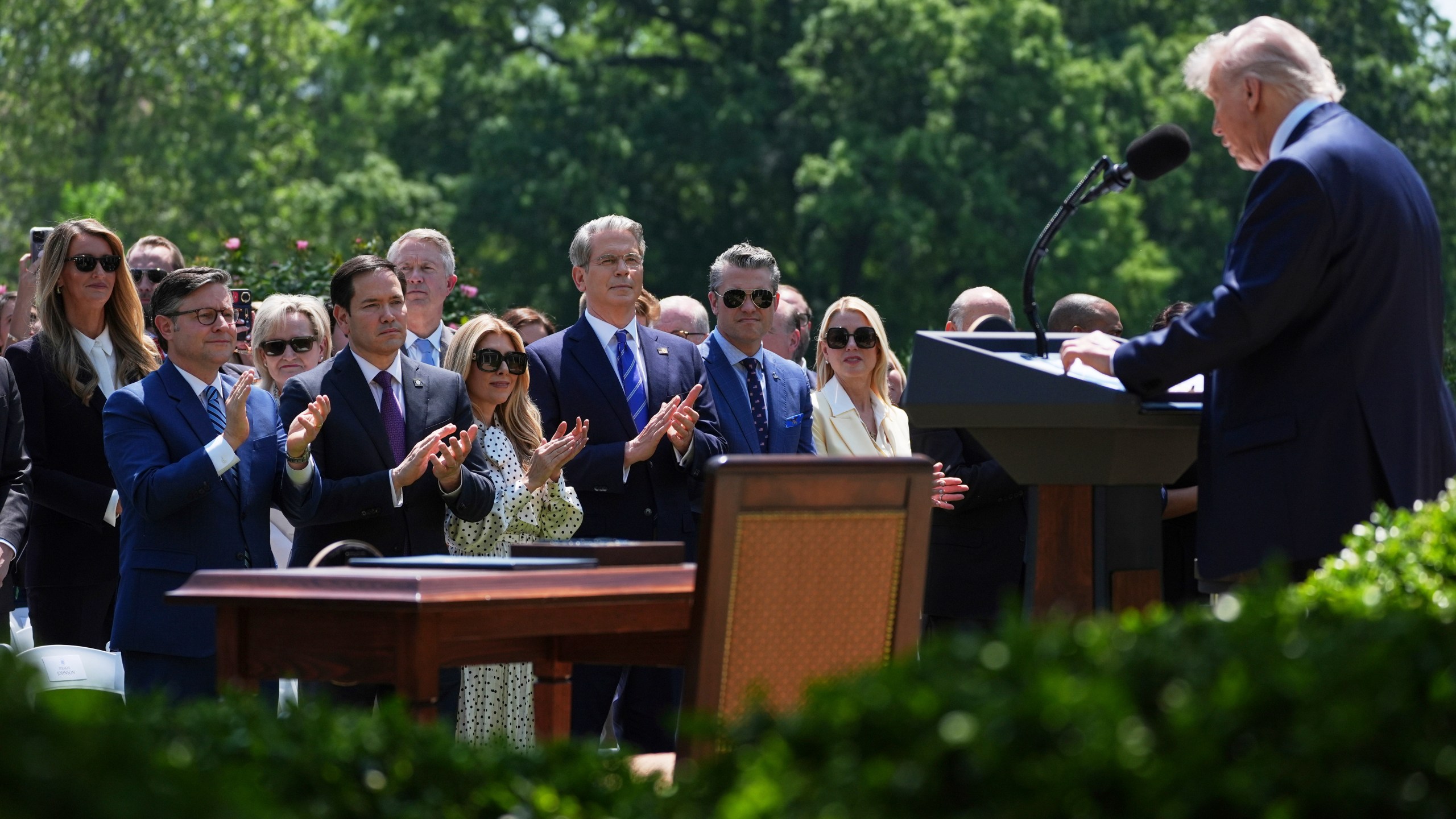 President Donald Trump speaks as House Speaker Mike Johnson, R-La., from front row left, Secretary of State Marco Rubio, and from front row right, Attorney General Pam Bondi, Defense Secretary Pete Hegseth and Treasury Secretary Scott Bessent listen during a National Day of Prayer event in the Rose Garden of the White House, Thursday, May 1, 2025, in Washington. (AP Photo/Evan Vucci)