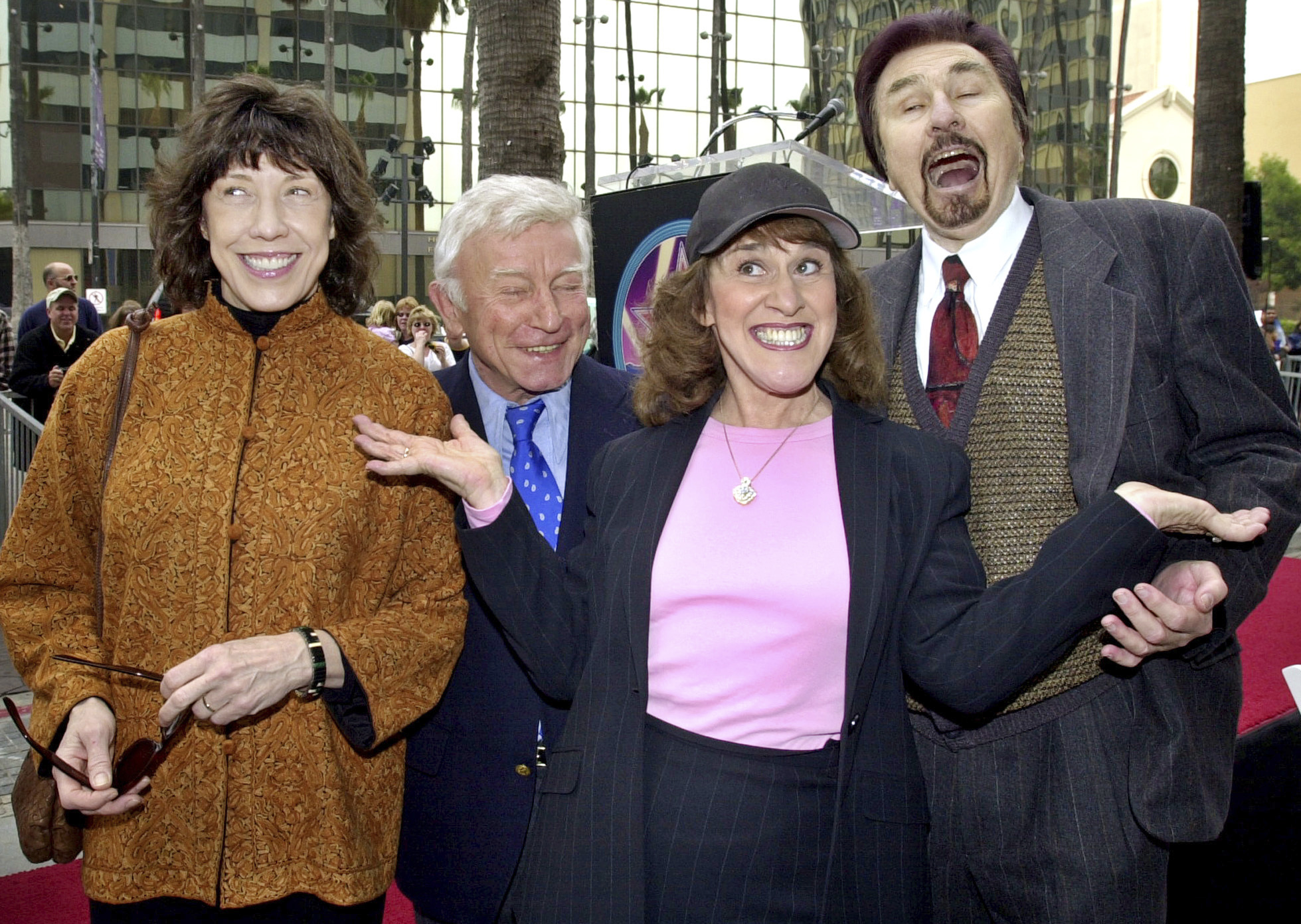 FILE - "Rowan & Martin's Laugh-In" cast members, from left, Lily Tomlin, Henry Gibson, Ruth Buzzi and Gary Owens pose for the media Tuesday, April 2, 2002, in the Hollywood section of Los Angeles. (AP Photo/Nick Ut, file)
