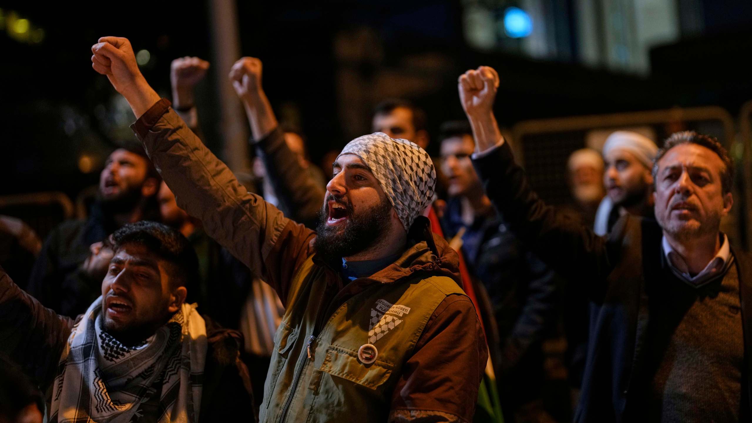 People protest against an Israeli drone attack on a vessel carrying aid to Gaza in international waters off Malta, outside the Israeli consulate in Istanbul, Friday, May 2, 2025. (AP Photo/Khalil Hamra)