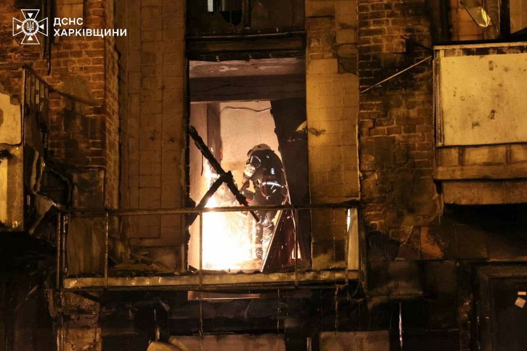 In this photo provided by the Ukrainian Emergency Service, emergency services personnel work to extinguish a fire following a Russian attack in Kharkiv, Ukraine, Saturday, May 3, 2025. (Ukrainian Emergency Service via AP)