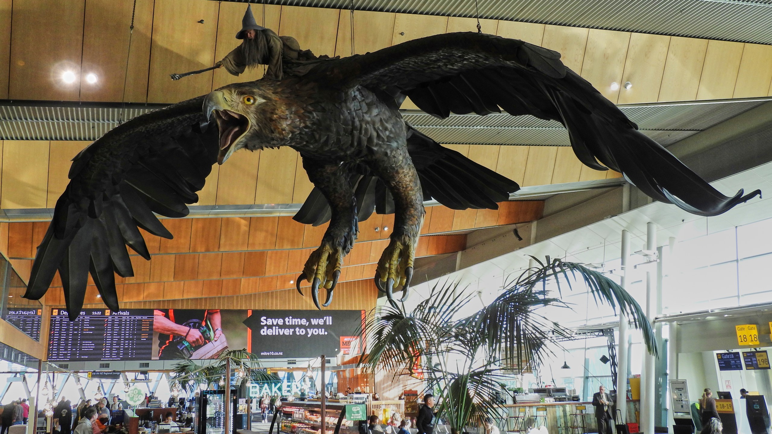 A sculpture of an eagle from the Hobbit films, ridden by the wizard Gandalf, hangs over the food court area of Wellington Airport, in Wellington, New Zealand, Monday, May 5, 2025. (AP Photo/Charlotte Graham-McLay)