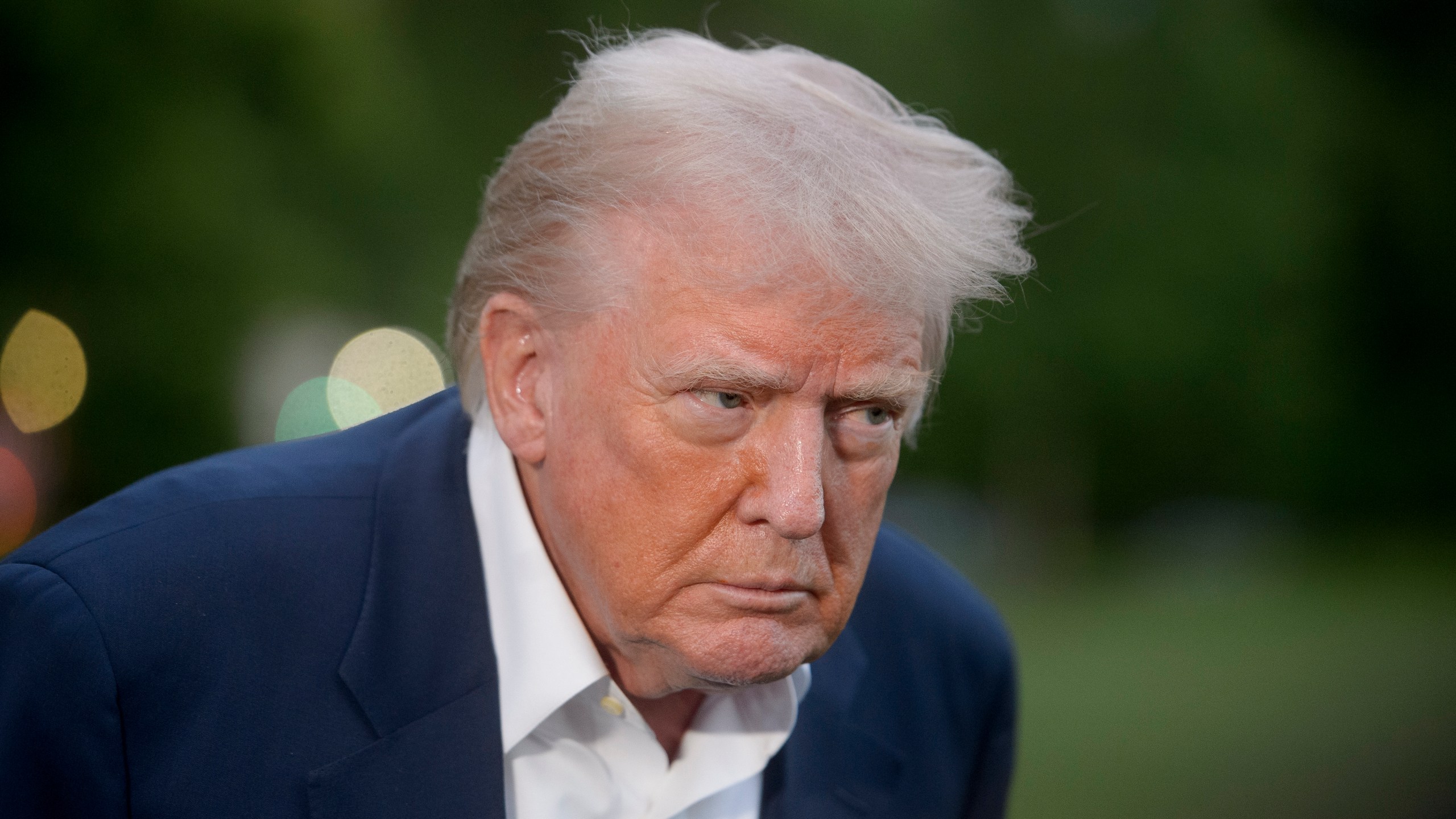 President Donald Trump speaks with reporters after disembarking Marine One upon arrival on the South Lawn of the White House in Washington, Sunday, May 4, 2025. (AP Photo/Rod Lamkey, Jr.)