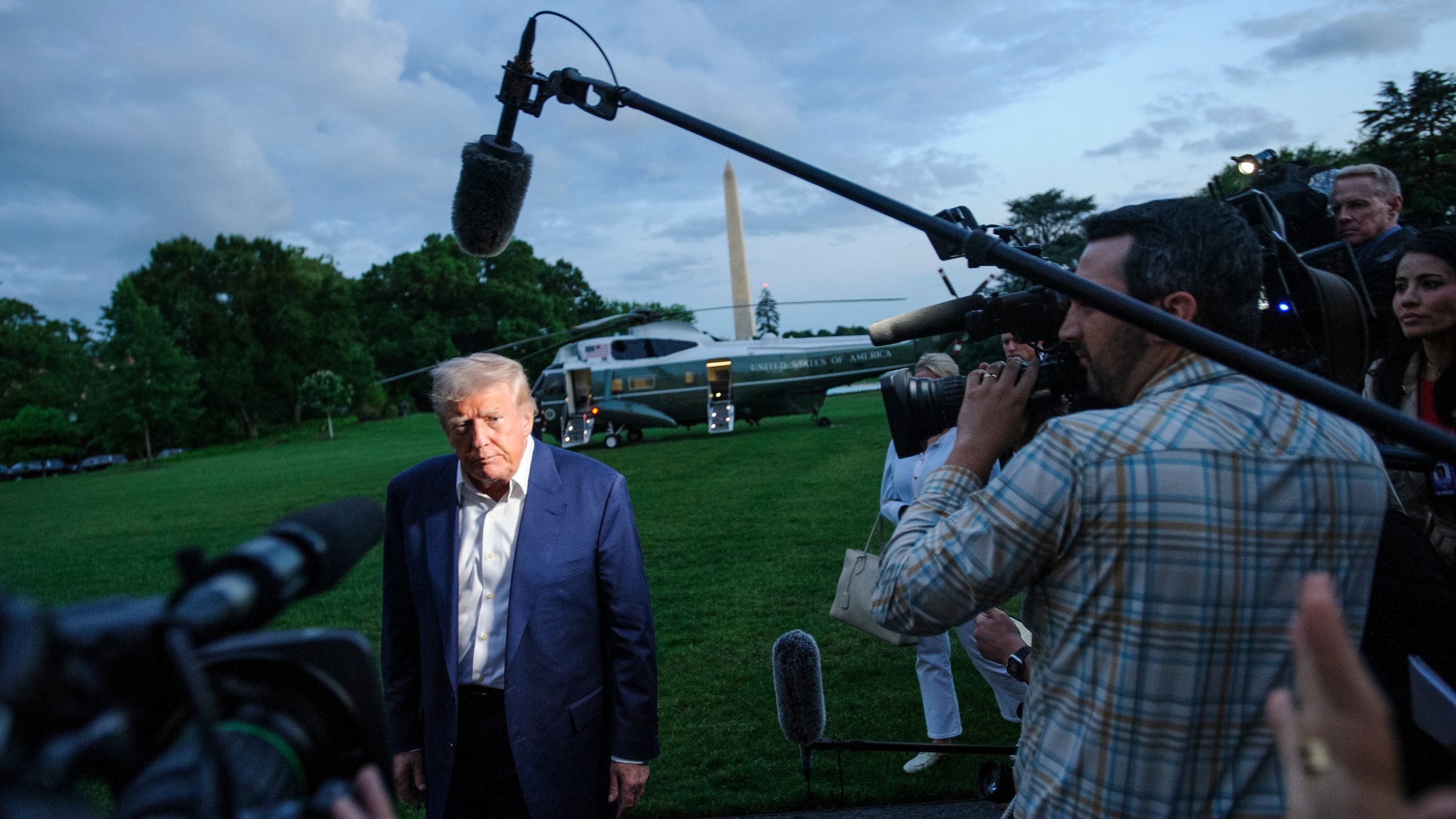 President Donald Trump speaks with reporters after disembarking Marine One upon arrival on the South Lawn of the White House in Washington, Sunday, May 4, 2025. (AP Photo/Rod Lamkey, Jr.)