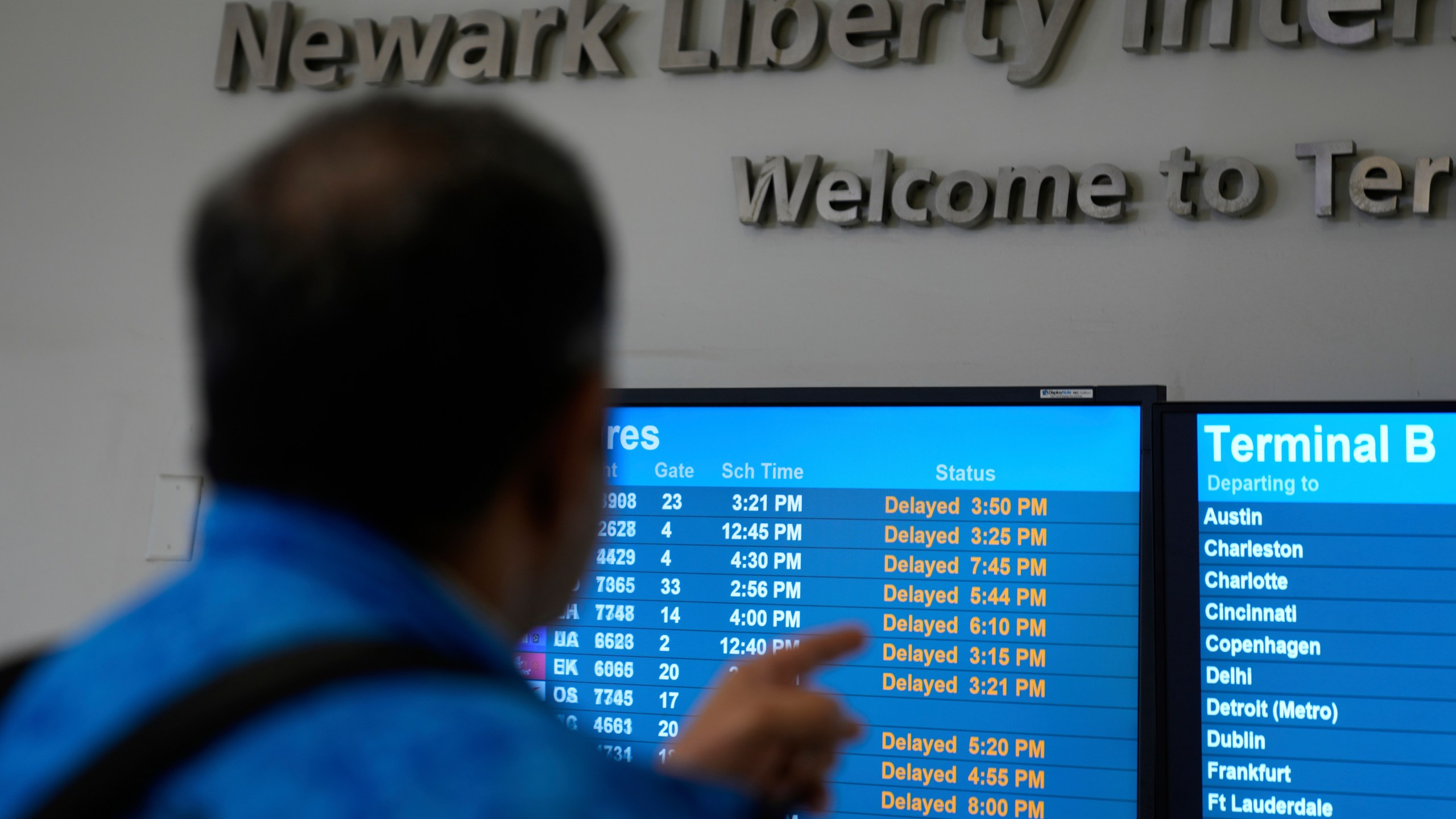 A display shows the status of flights at Newark Liberty International Airport in Newark, N.J., Monday, May 5, 2025. (AP Photo/Seth Wenig)
