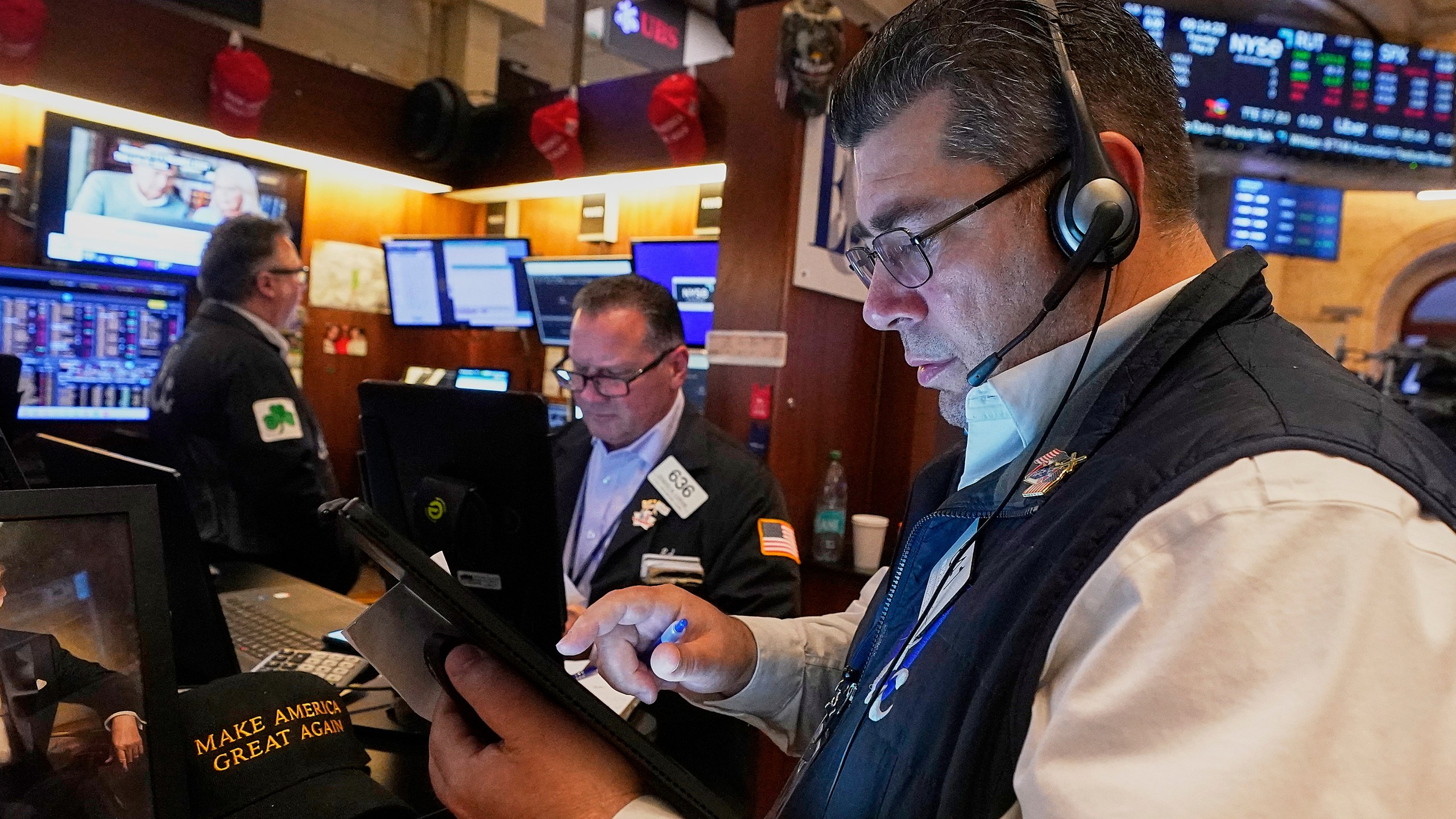 Trader Michael Capolino, right, works with colleagues on the floor of the New York Stock Exchange, Tuesday, May 6, 2025. (AP Photo/Richard Drew)