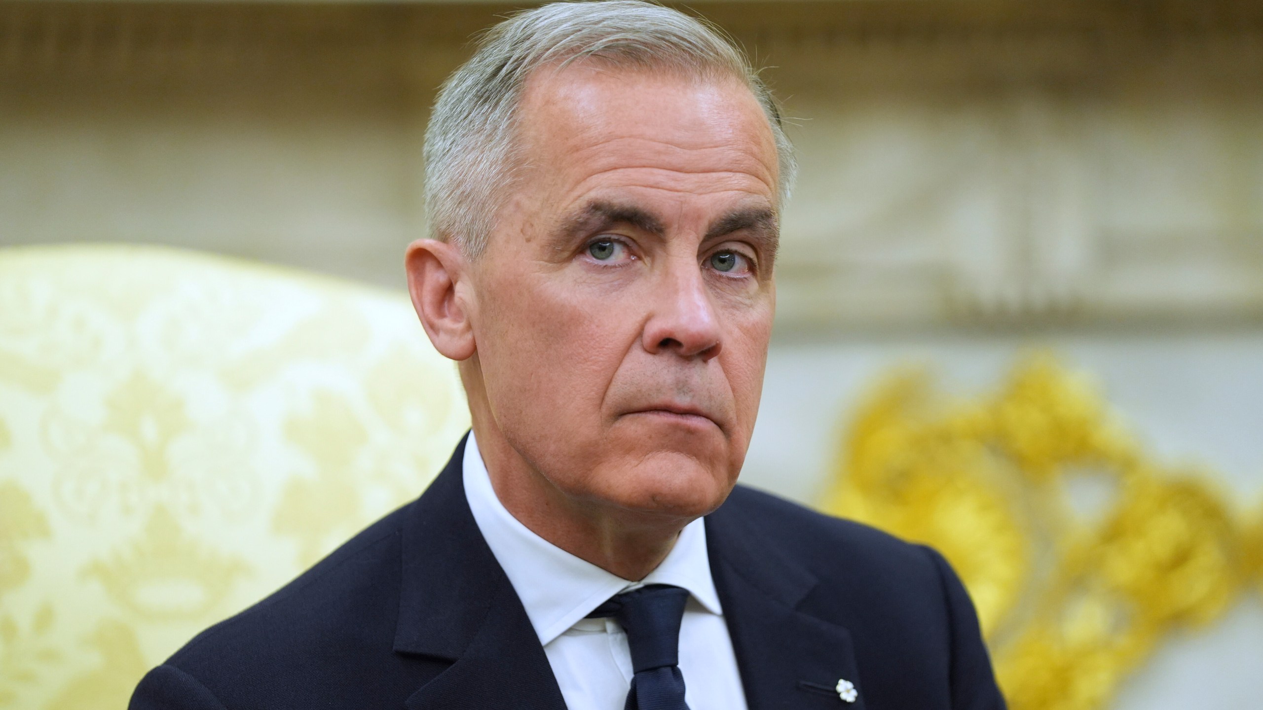Canadian Prime Minister Mark Carney listtens to questions during a meeting with President Donald Trump in the Oval Office of the White House, Tuesday, May 6, 2025, in Washington. (AP Photo/Evan Vucci)
