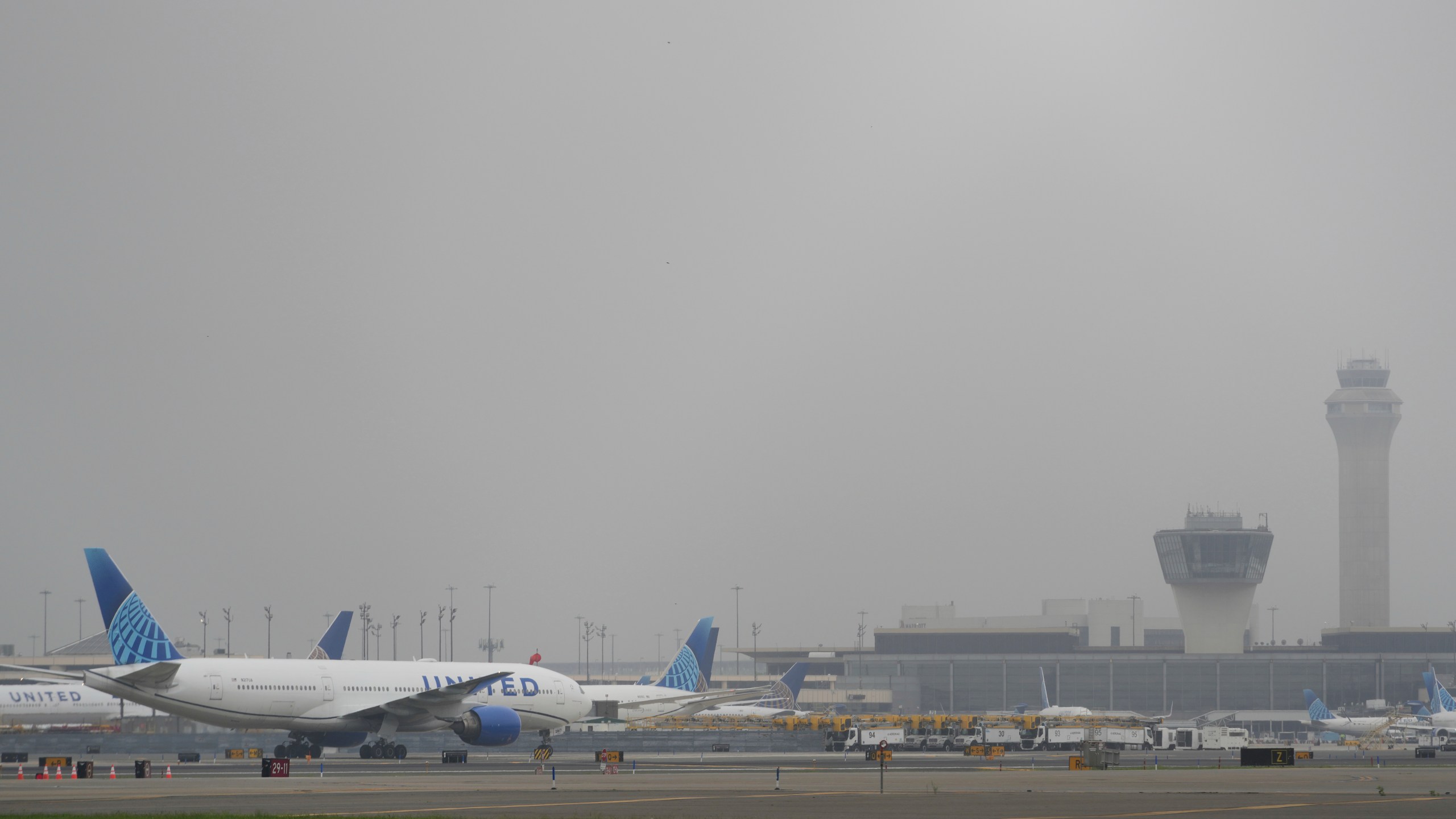 Fog covers planes and control towers at Newark Liberty International Airport in Newark, N.J., Monday, May 5, 2025. (AP Photo/Seth Wenig)