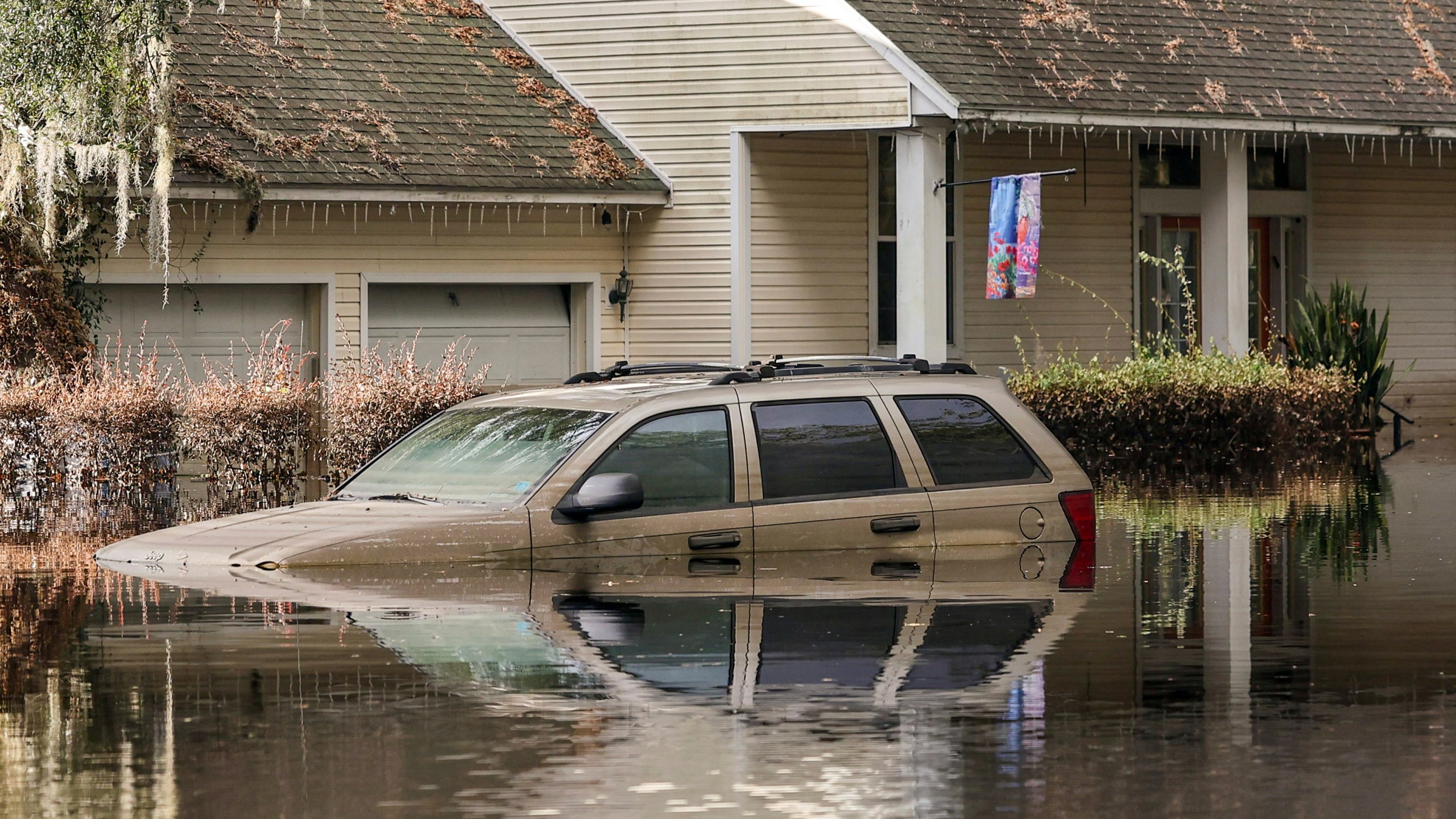 FILE - A neighborhood still flooded from Hurricane Milton prepares to have the FEMA Disaster Recover Center covert to a polling location for the general election on Monday, Nov. 4, 2024, in Ridge Manor, Fla. (AP Photo/Mike Carlson, File)