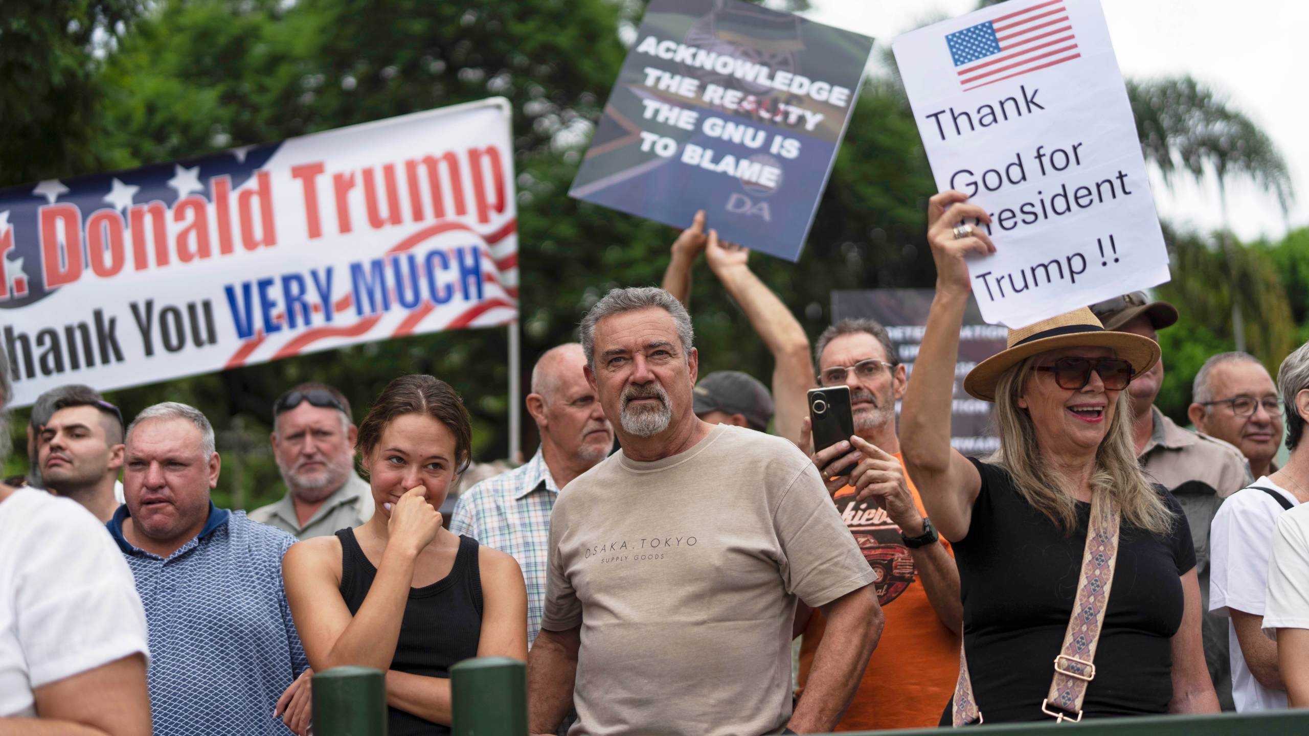 FILE - White South Africans demonstrate in support of U.S. President Donald Trump in front of the U.S. embassy in Pretoria, South Africa, Feb. 15, 2025. (AP Photo/Jerome Delay, File)