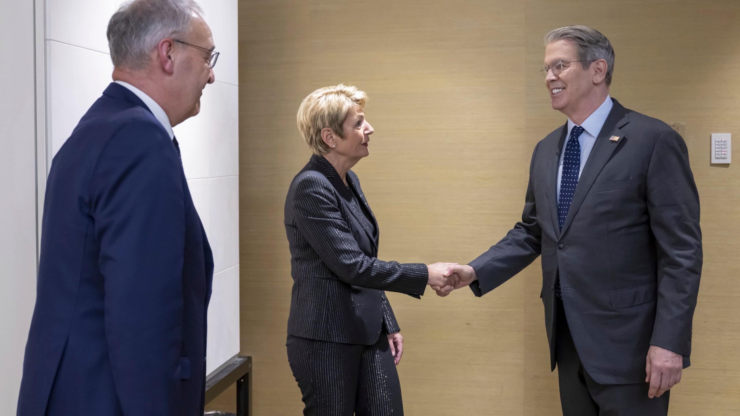 US Secretary of the Treasury Scott Bessent, right, shakes hands with Switzerland's President Karin Keller-Sutter, center, next to Switzerland's Economy Minister Federal Councillor Guy Parmelin, left, during a bilateral meeting between Switzerland and the United States, in Geneva, Switzerland, on Friday, May 9, 2025. (Martial Trezzini/Keystone via AP)