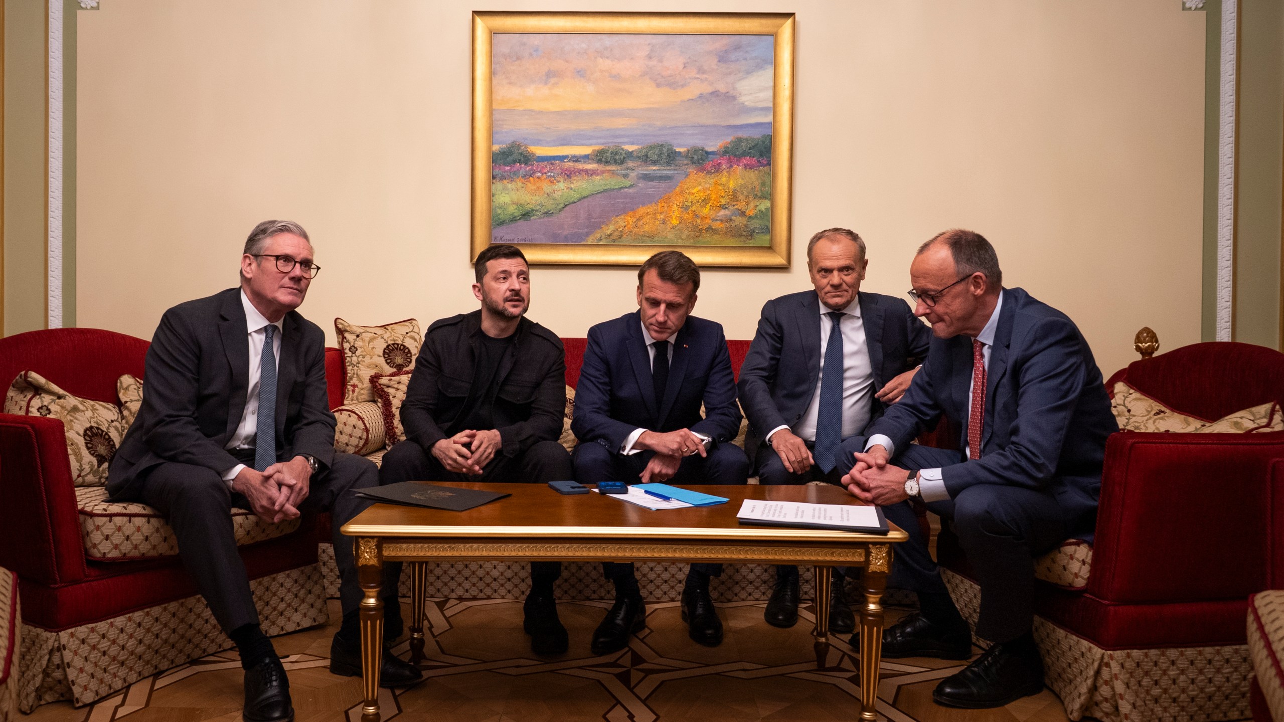 a group of officials making a call