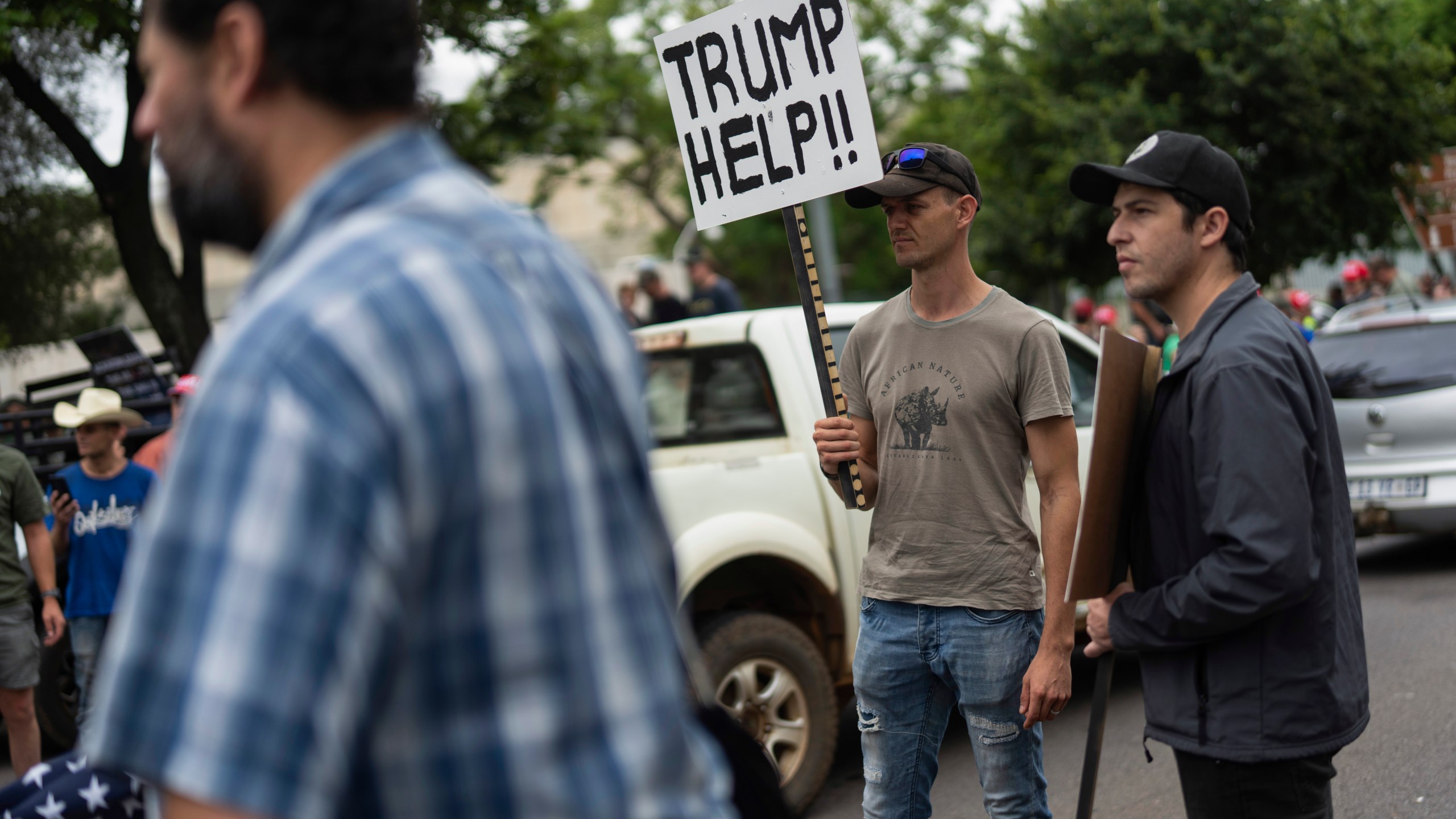 FILE - White South Africans demonstrate in support of U.S. President Donald Trump in front of the U.S. embassy in Pretoria, South Africa, Saturday, Feb. 15, 2025. (AP Photo/Jerome Delay, File)