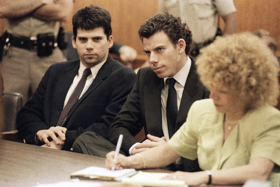 FILE - Lyle, left, and Erik Galen Menendez sit in Beverly Hills, Calif., courtroom, May 14, 1990 as a judge postponed their preliminary hearing on charges of murdering their parents last August. (AP Photo/Kevork Djansezian, File)