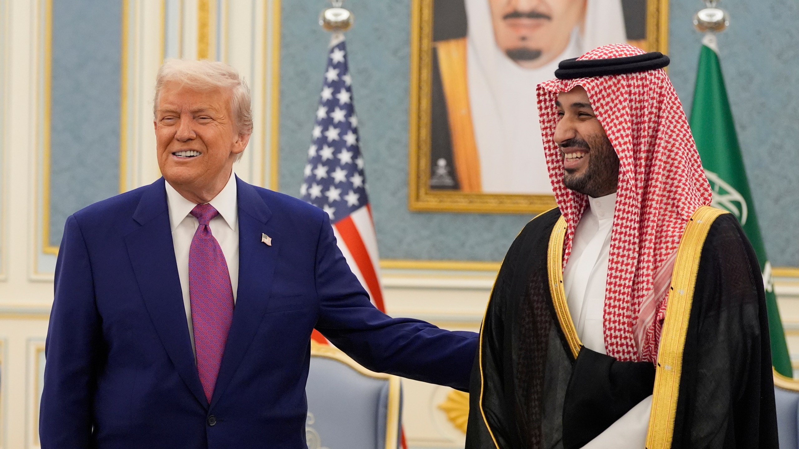 President Donald Trump and Saudi Crown Prince Mohammed bin Salman gesture as they meet delegations at the Royal Palace in Riyadh, Saudi Arabia, Tuesday, May 13, 2025. (AP Photo/Alex Brandon)