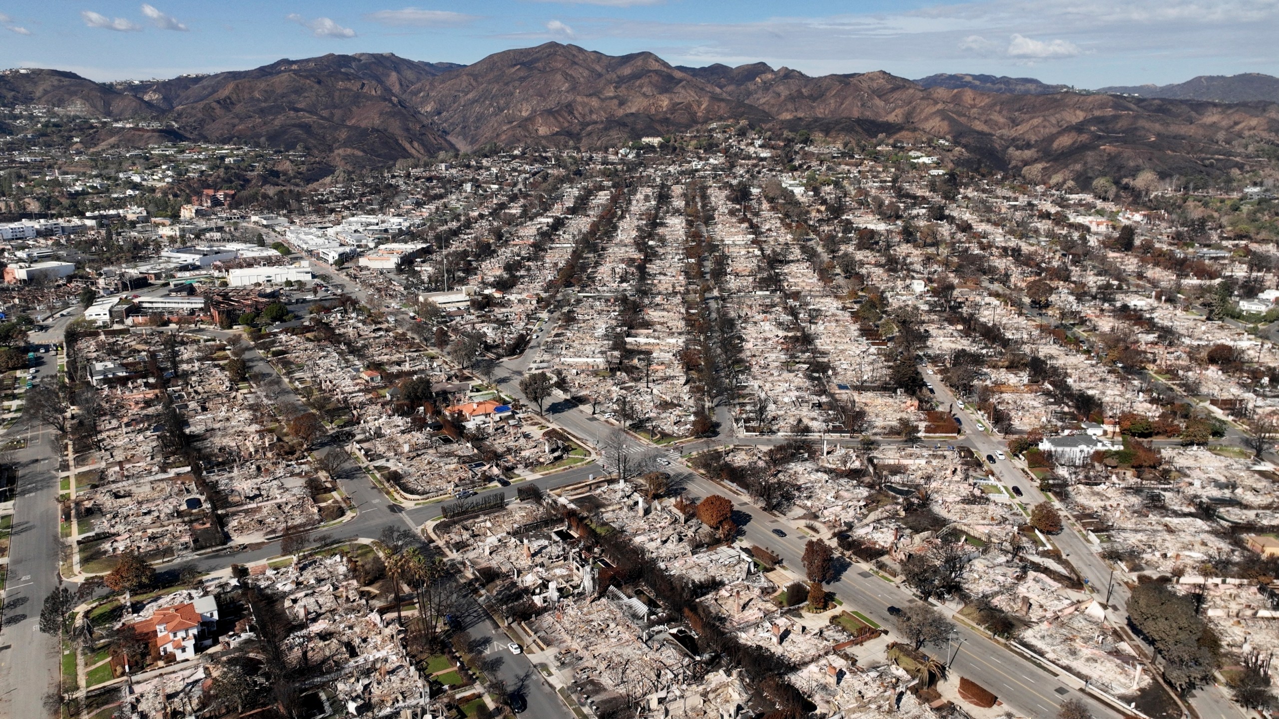The devastation from the Palisades Fire is shown in an aerial view in the Pacific Palisades neighborhood of Los Angeles.