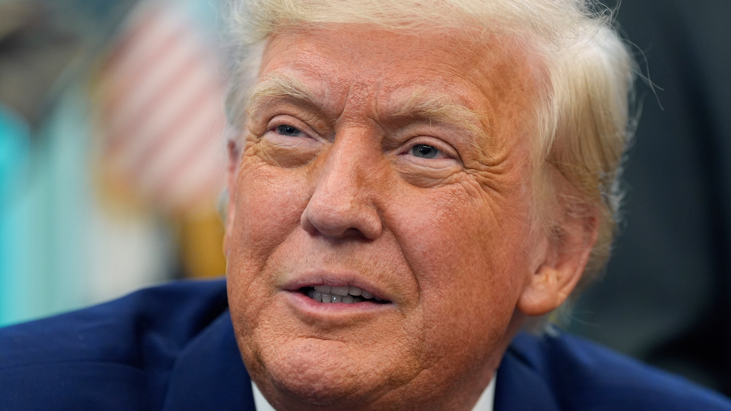 President Donald Trump speaks with reporters as he signs an executive order in the Oval Office of the White House, Friday, May 9, 2025, in Washington. (AP Photo/Alex Brandon)