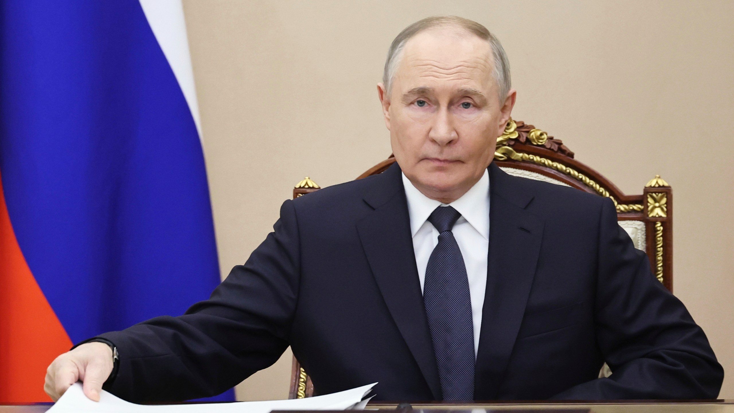 Vladimir Putin attends a meeting