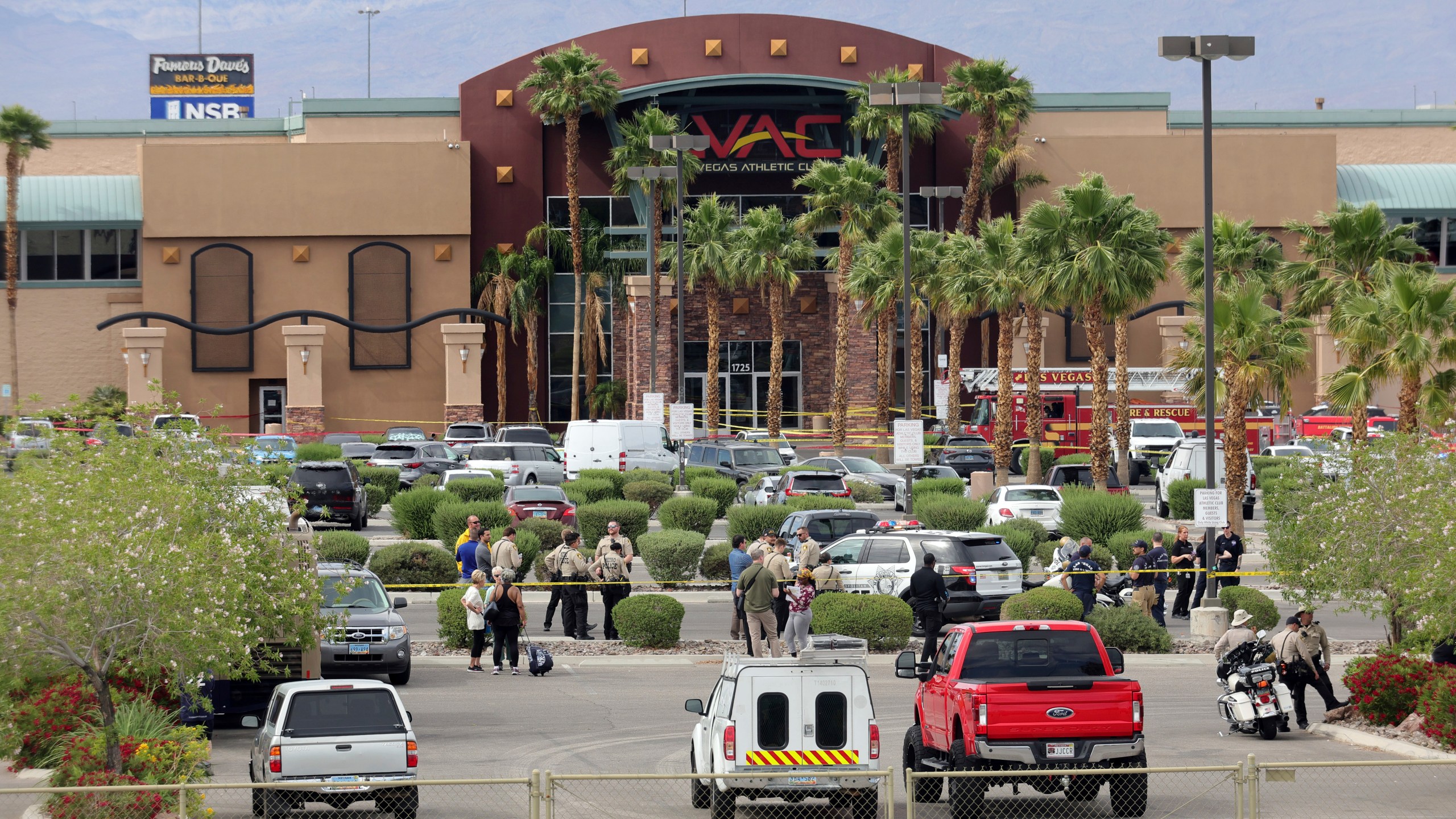 Las Vegas Metro Police officers are shown in front of a Las Vegas Athletic Club after a shooting Friday, May 16, 2025, in Las Vegas. (Steve Marcus/Las Vegas Sun via AP)