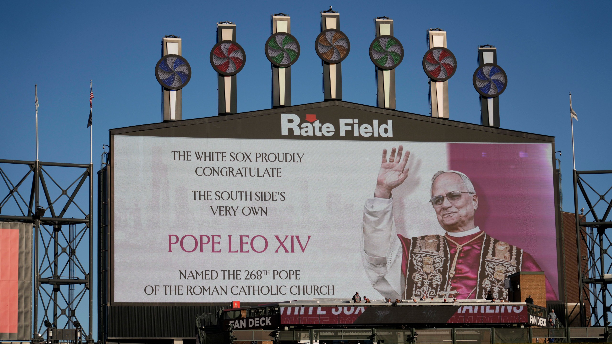The Chicago White Sox honors Pope Leo XIV on the scoreboard before a baseball game against the Miami Marlins, Friday, May 8, 2025, in Chicago. (AP Photo/David Banks)