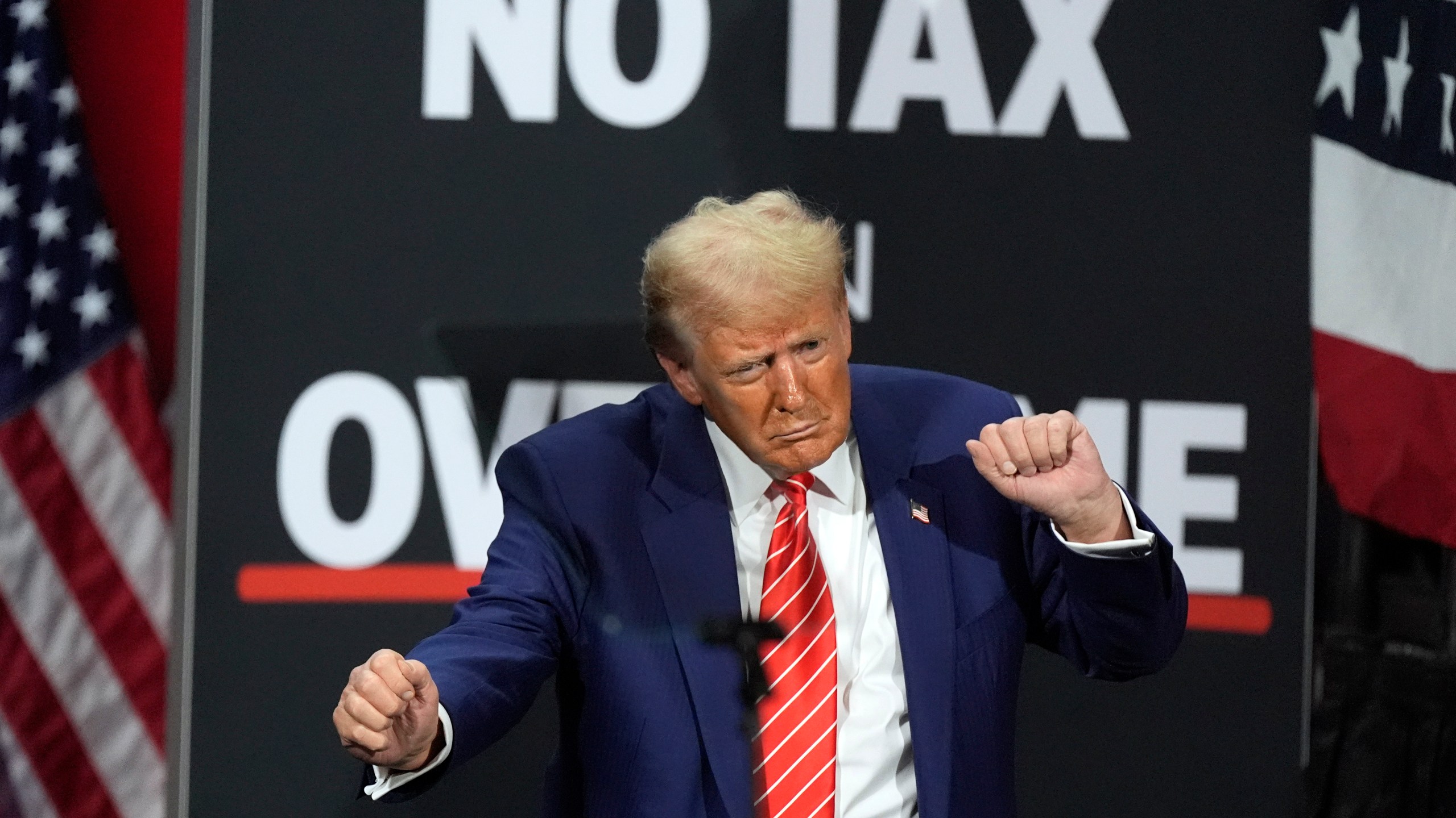 FILE - Republican presidential nominee former President Donald Trump dances at a campaign event at the Cobb Energy Performing Arts Centre, Oct. 15, 2024, in Atlanta. (AP Photo/John Bazemore, File)