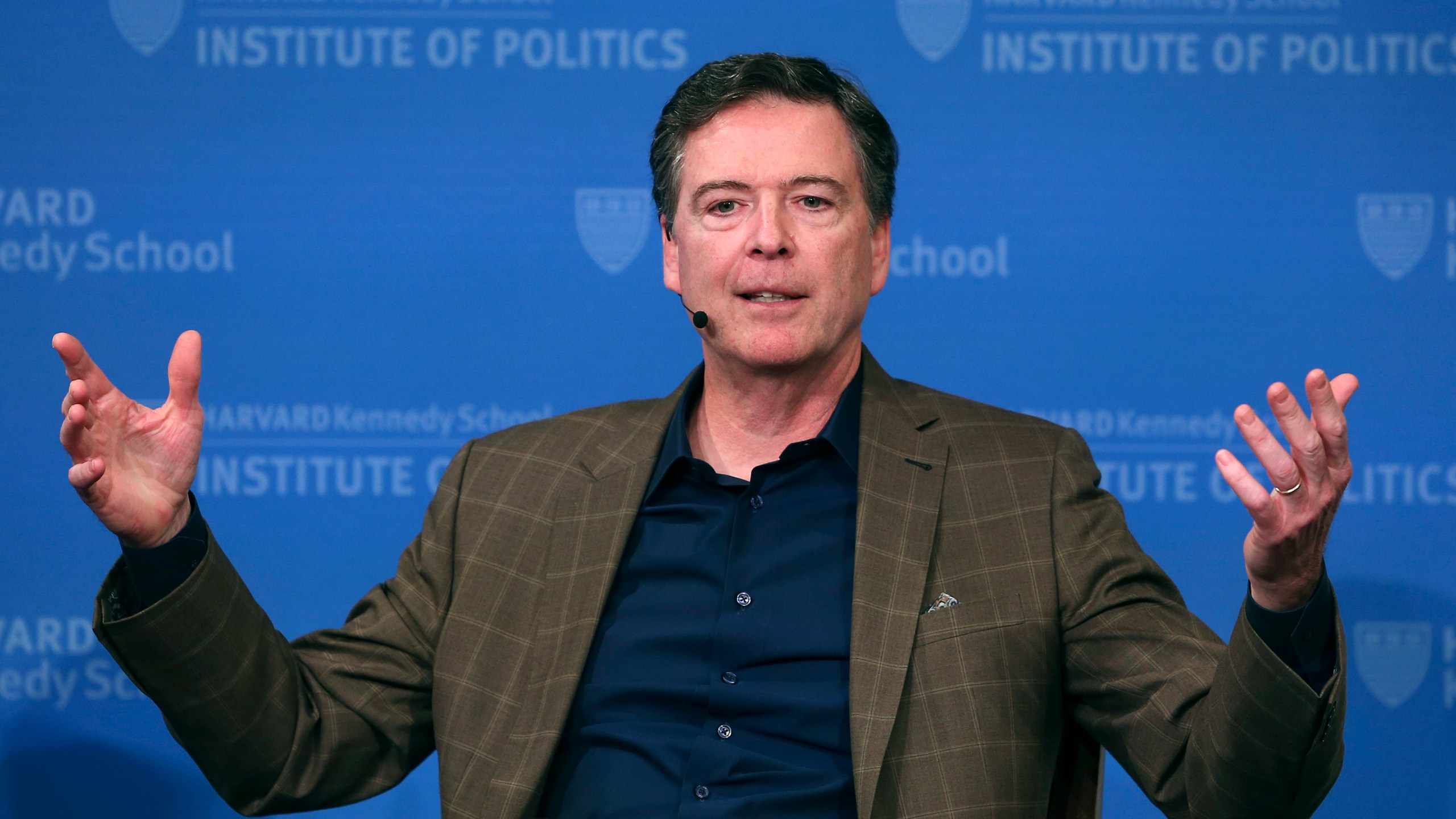 FILE - Former FBI director James Comey gestures while speaking at Harvard University's Institute of Politics' JFK Jr. Forum in Cambridge, Mass., Feb. 24, 2020. (AP Photo/Charles Krupa, File)