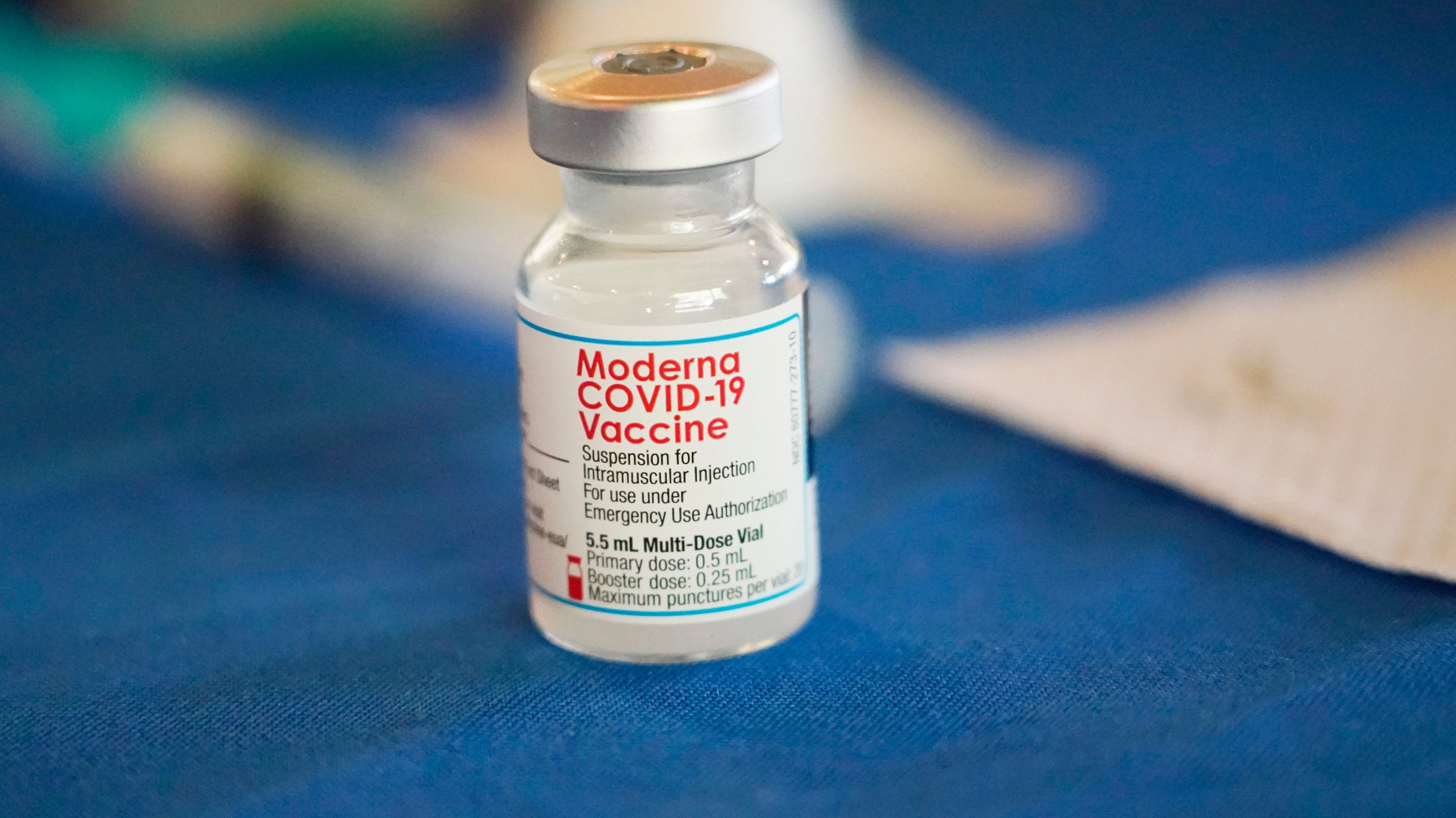 FILE - A vial of Moderna COVID-19 vaccine rests on a table at an inoculation station in Jackson, Miss., on July 19, 2022. (AP Photo/Rogelio V. Solis, File)