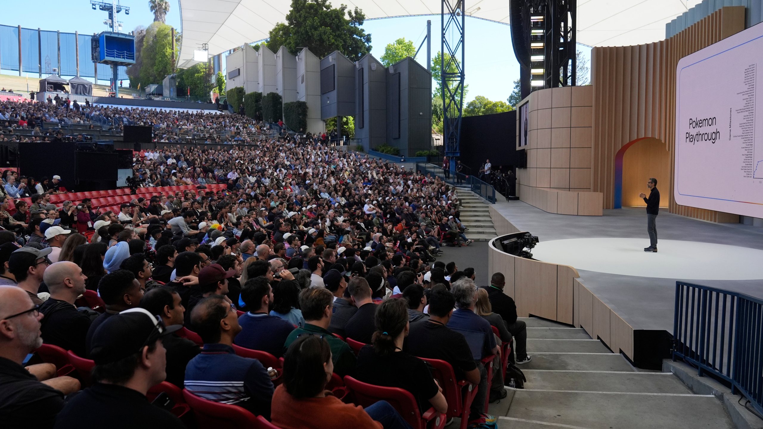 Alphabet CEO Sundar Pichai, right, speaks at a Google I/O event in Mountain View, Calif., Tuesday, May 20, 2025. (AP Photo/Jeff Chiu)