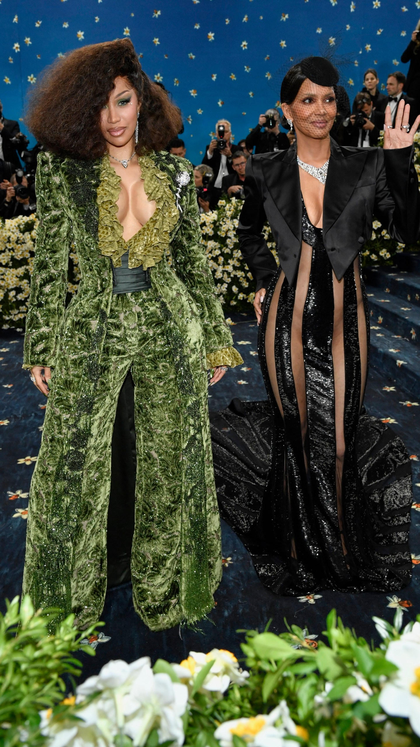 Cardi B, left and Halle Berry attend The Metropolitan Museum of Art's Costume Institute benefit gala celebrating the opening of the "Superfine: Tailoring Black Style" exhibition on Monday, May 5, 2025, in New York. (Photo by Evan Agostini/Invision/AP)