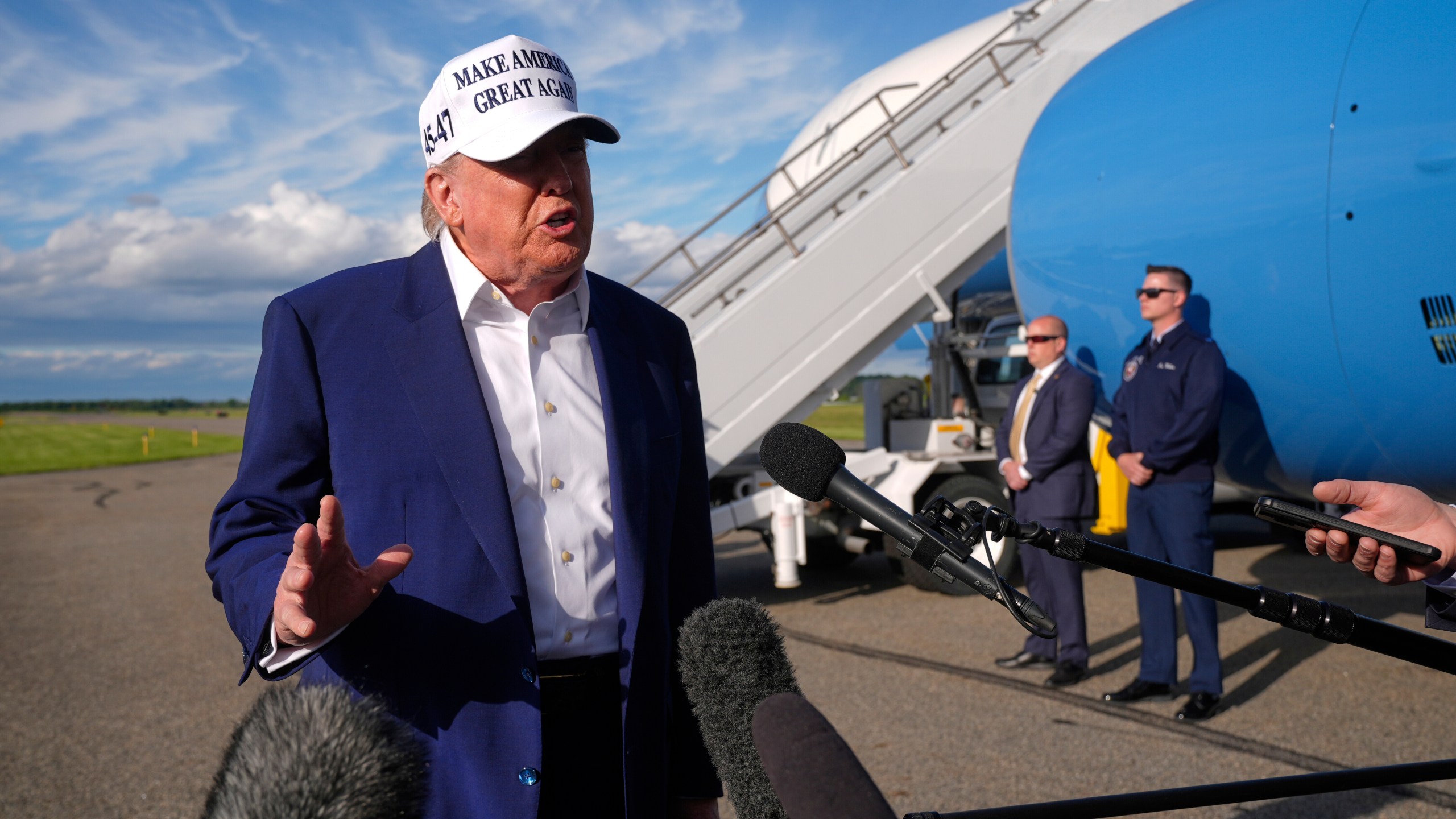 President Donald Trump speaks to reporters before boarding Air Force One at Morristown Municipal Airport in Morristown, N.J., Sunday, May 25, 2025. (AP Photo/Manuel Balce Ceneta)