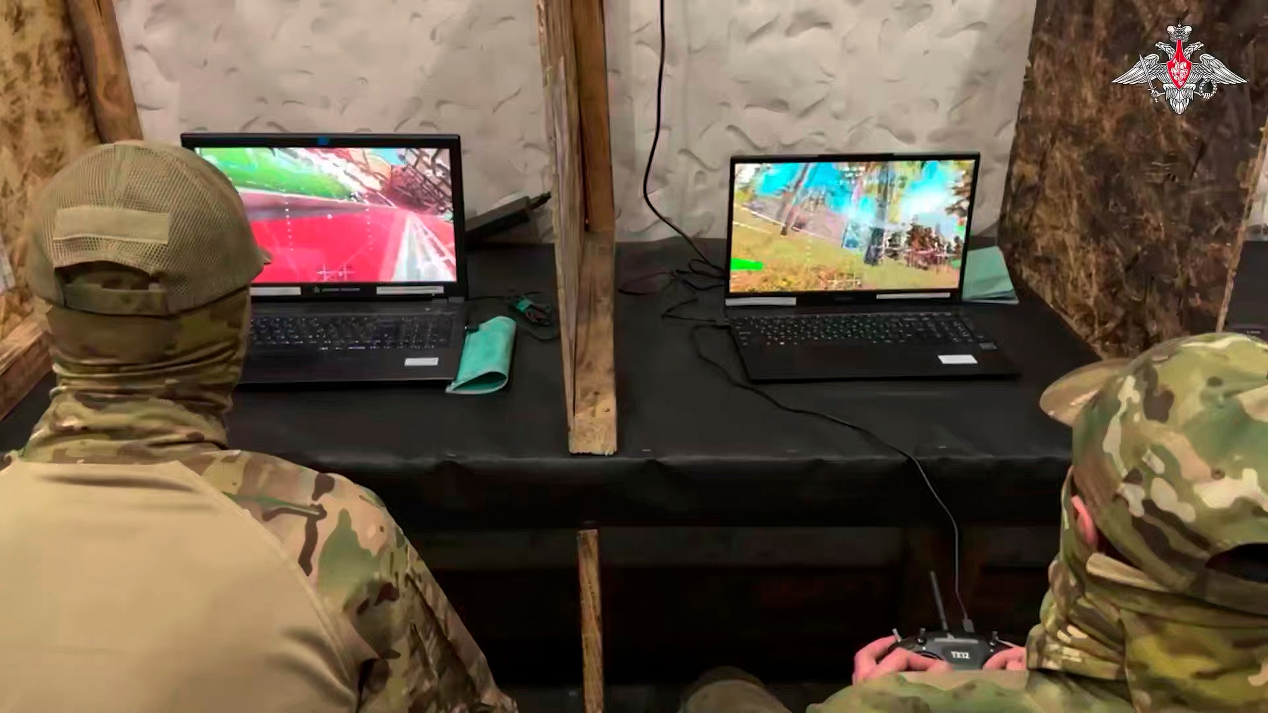 In this photo taken from video distributed by the Russian Defense Ministry Press Service on Monday, May 26, 2025, Russian serviceman train to operate military drones in an undisclosed location. (Russian Defense Ministry Press Service via AP)