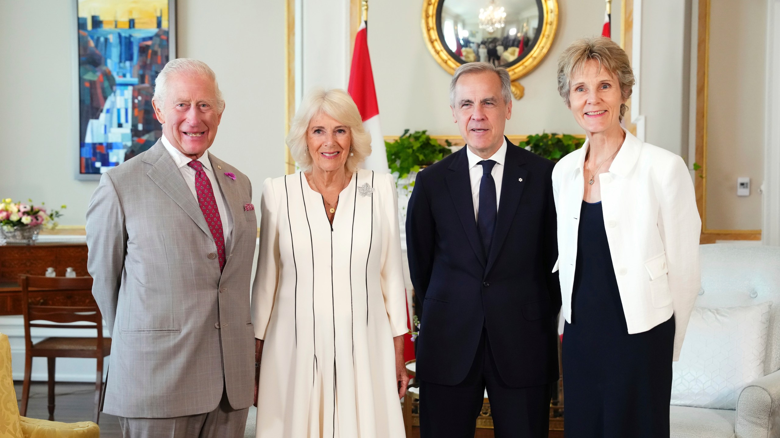 King Charles, Queen Camilla, Mark Carney and his wife pose for a photo