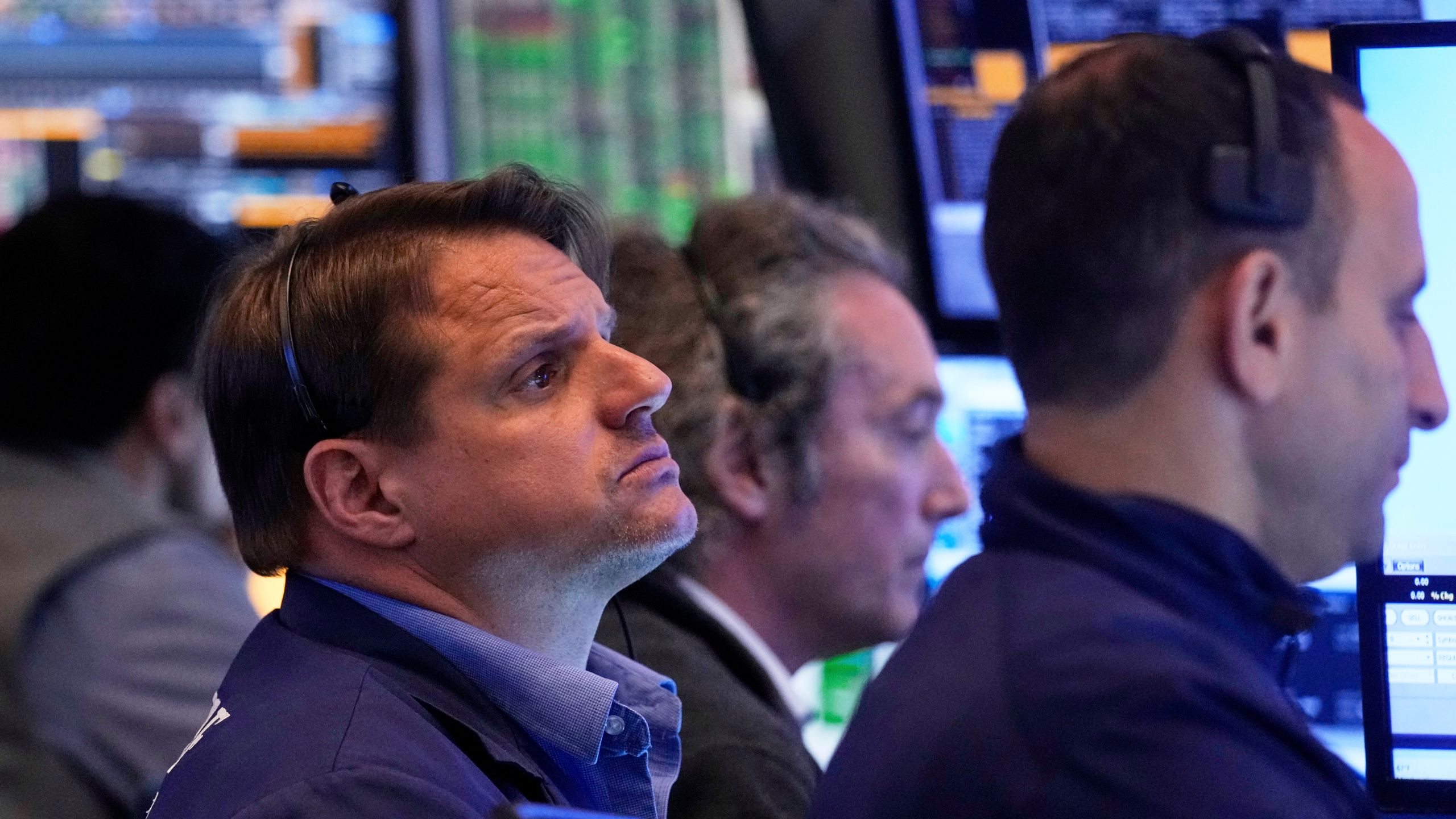 Trader Michael Milano, left, works with colleagues on the floor of the New York Stock Exchange, Tuesday, May 27, 2025. (AP Photo/Richard Drew)